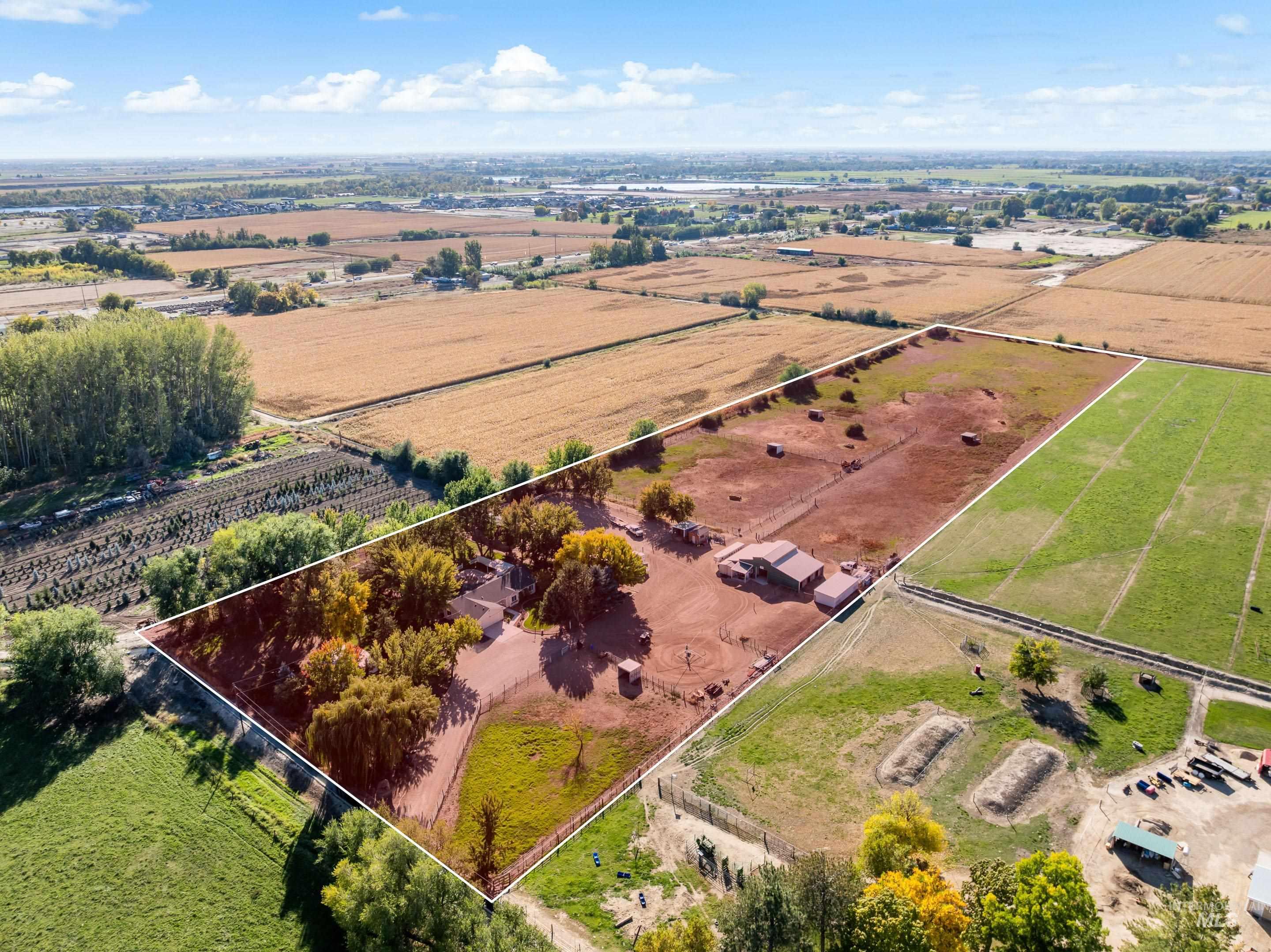 Aerial view of sparsely populated area with property boundaries highlighted and extensive farmland
