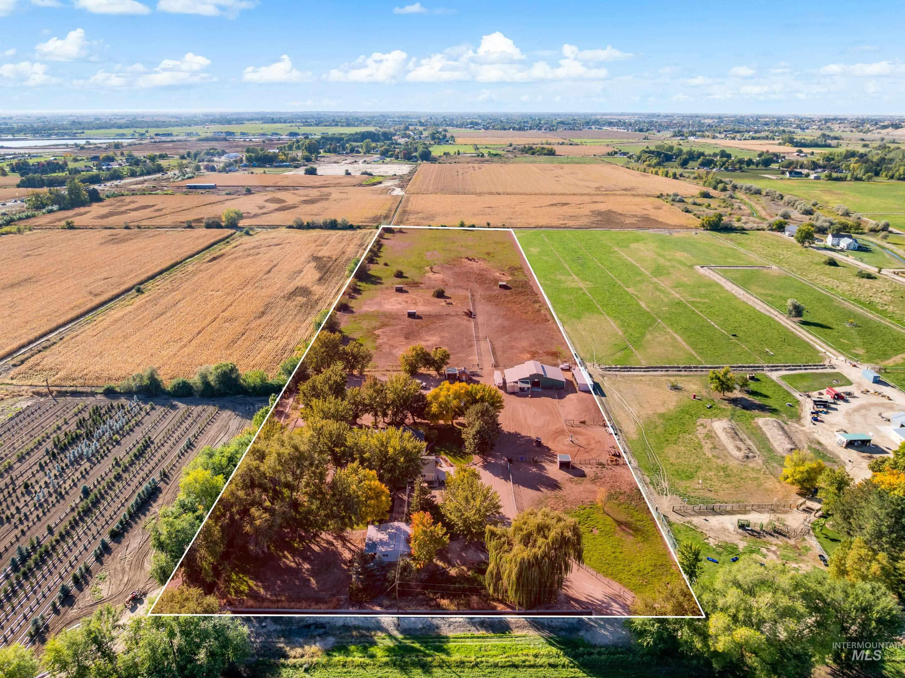 Overview of rural landscape featuring extensive farmland and property parcel outlined