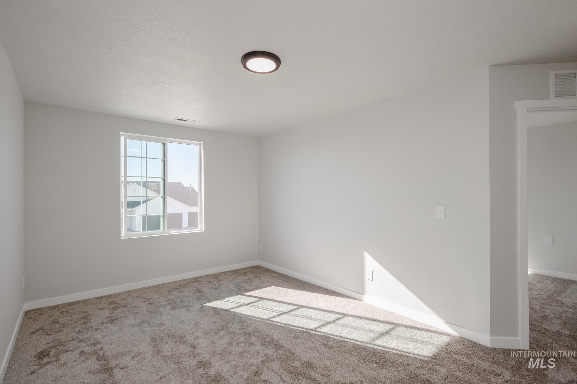 Unfurnished room featuring carpet flooring