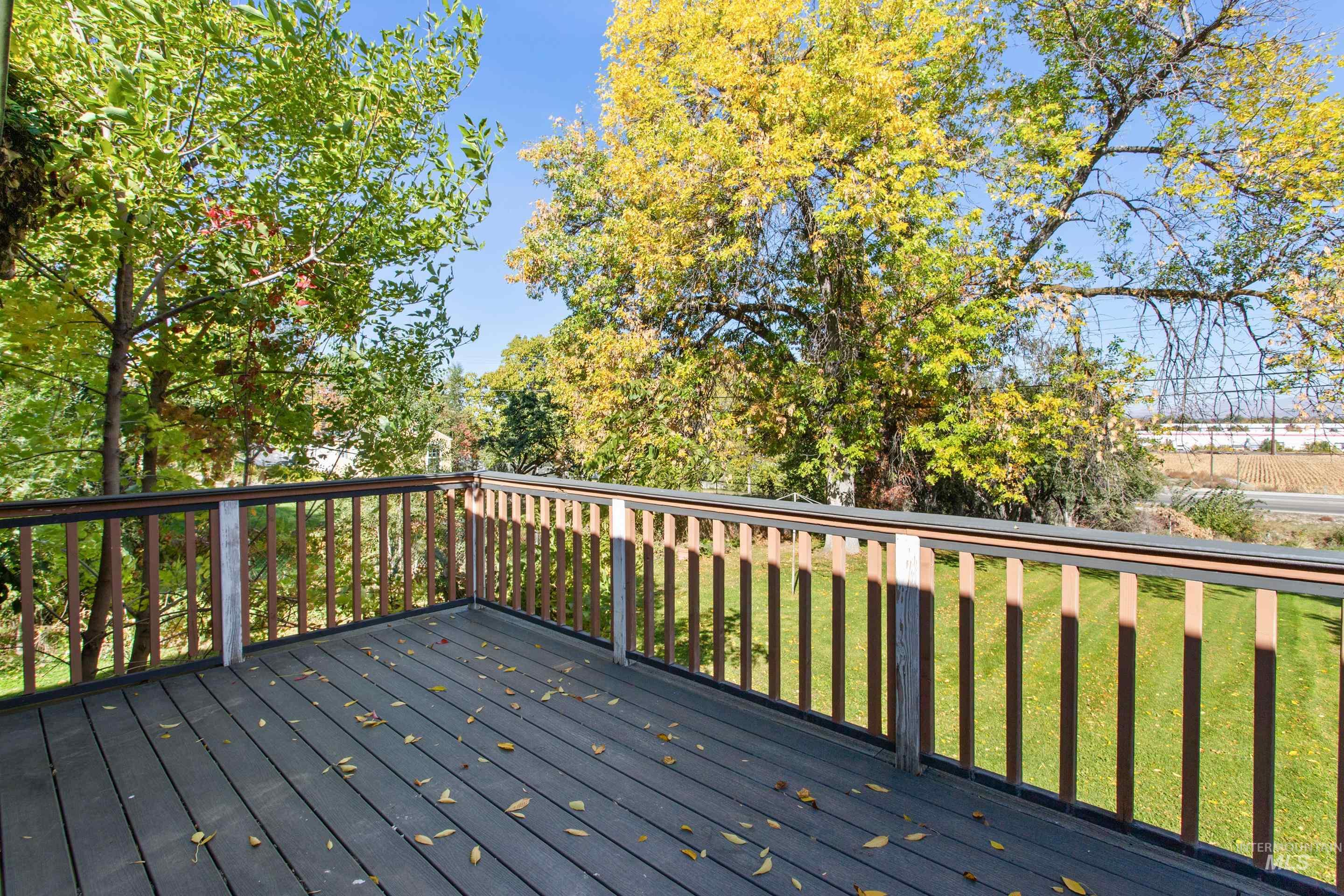 Wooden terrace with a lawn