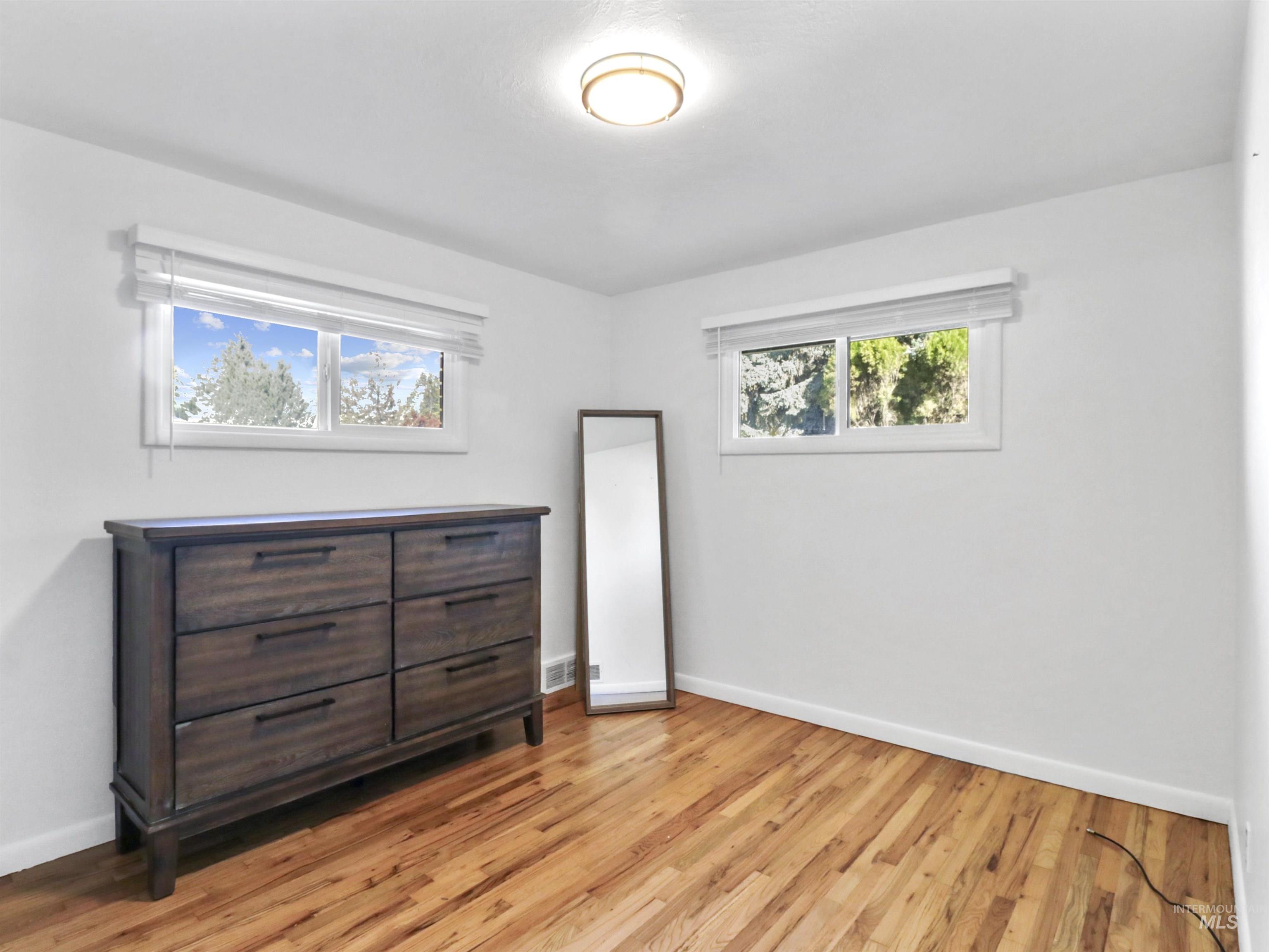 Bedroom with light wood-style flooring