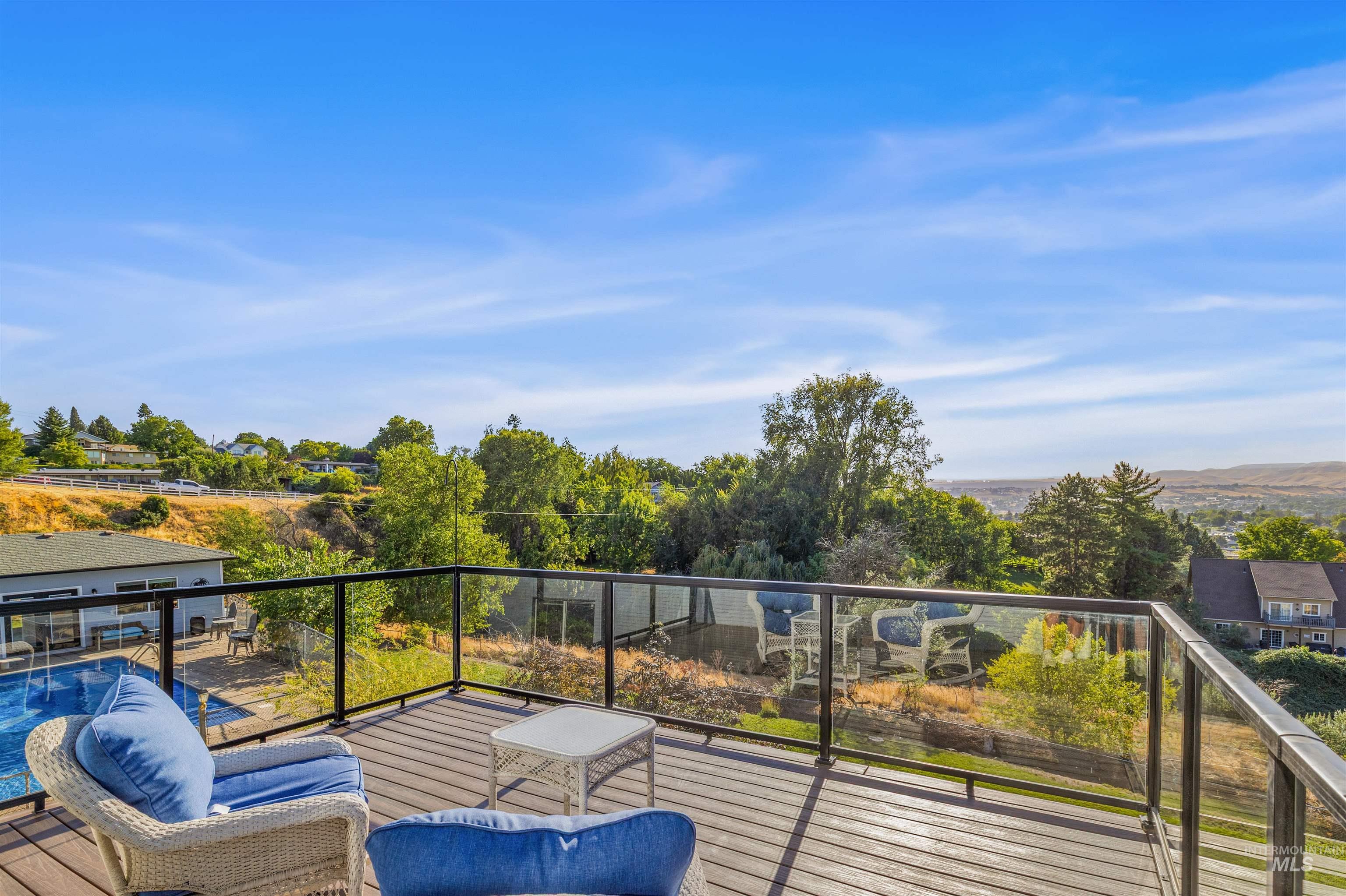 Balcony with view of wooded area