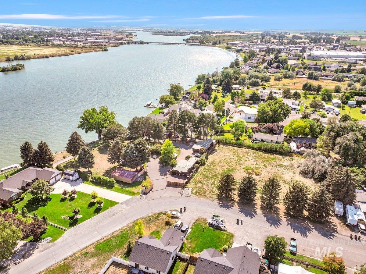 Aerial perspective of suburban area with a large body of water
