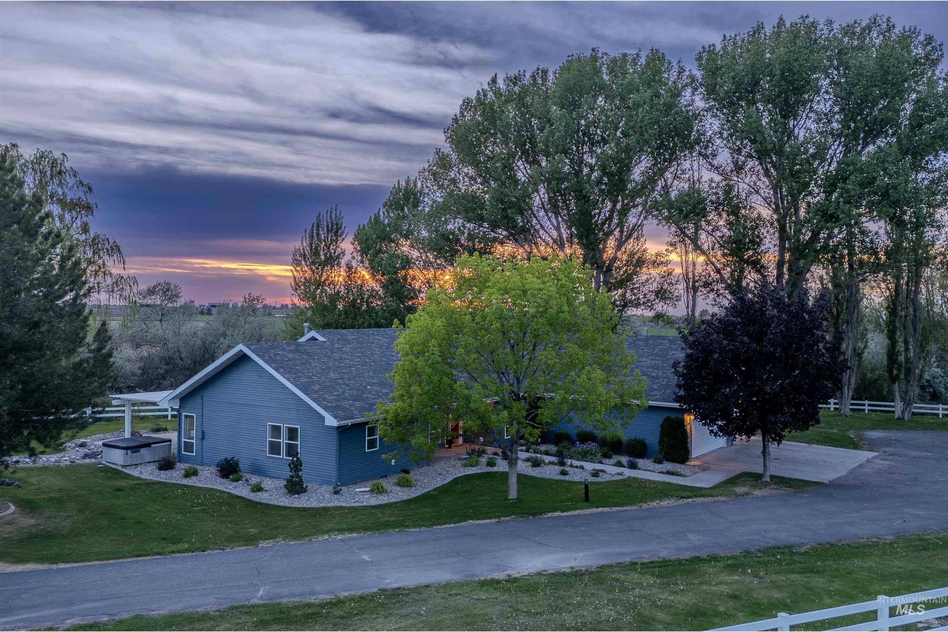 Single-story property with a blue exterior and gray roof