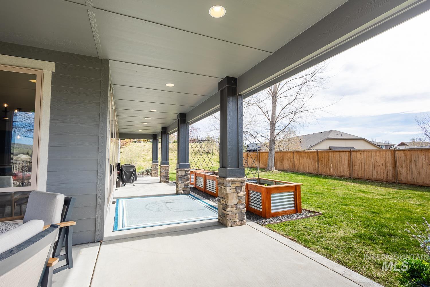 View of patio featuring a grill