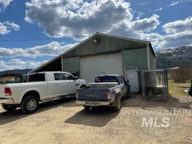 View of outbuilding with driveway