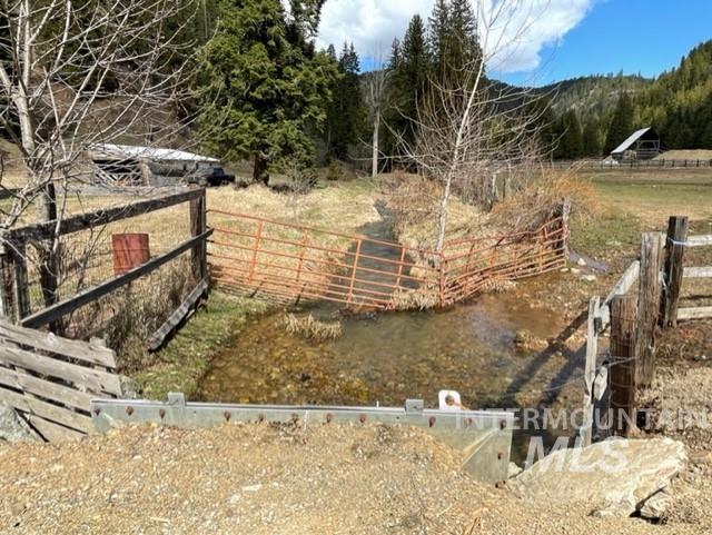 View of yard with a mountain view and a rural view