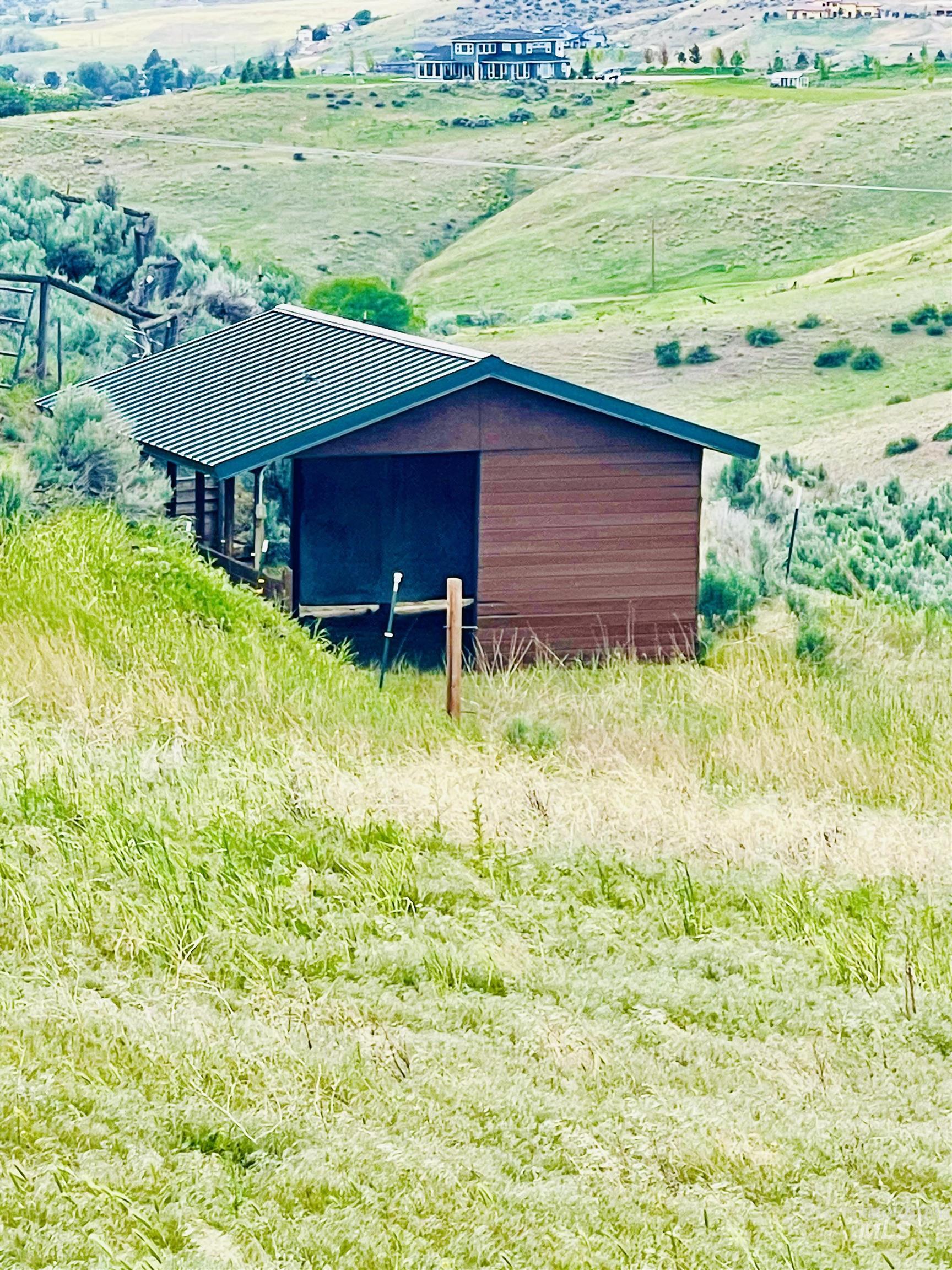 View of pole building featuring a view of countryside