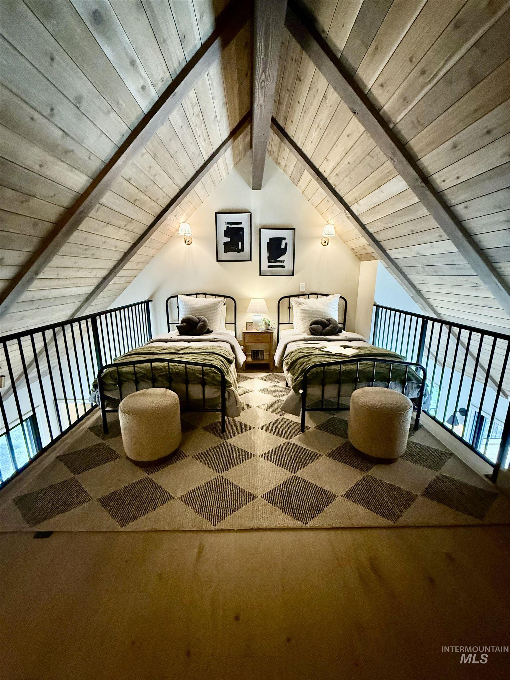 Living area featuring wooden ceiling and carpet flooring