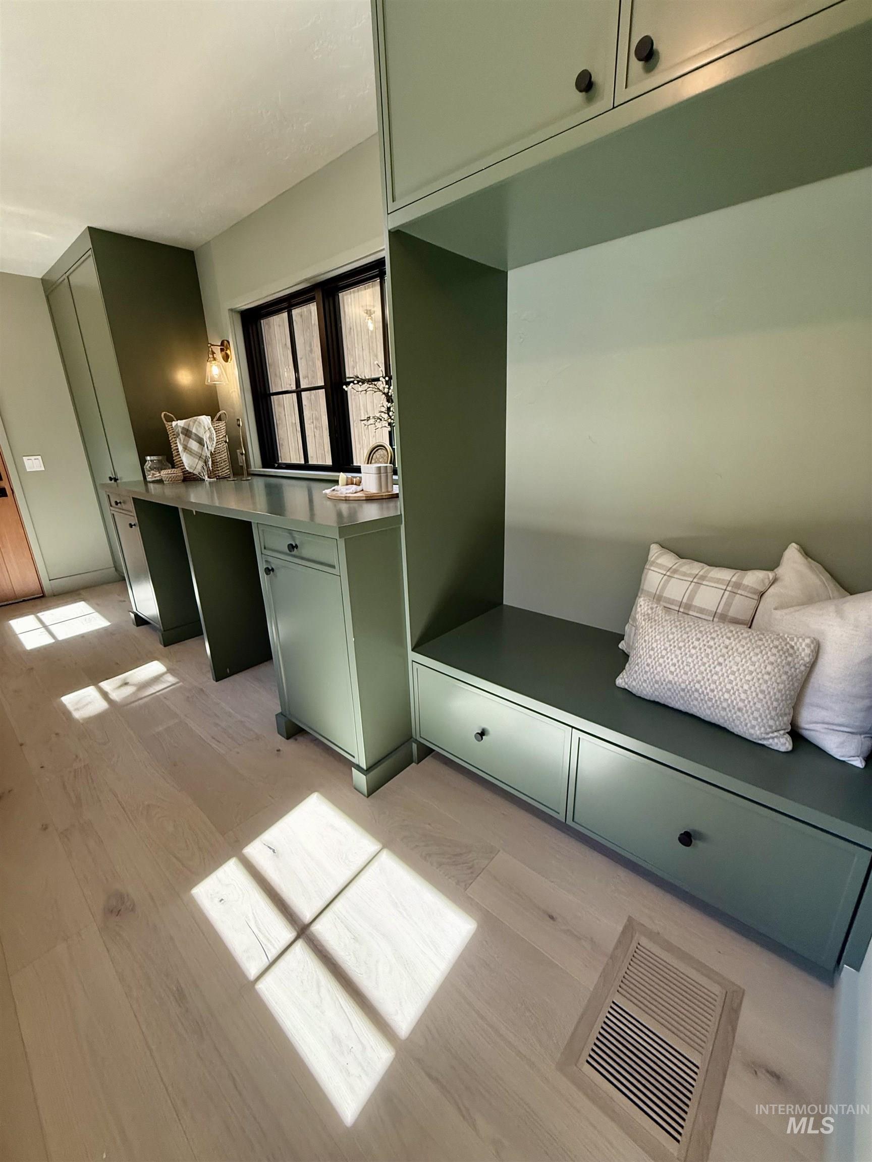 Mudroom with light wood finished floors