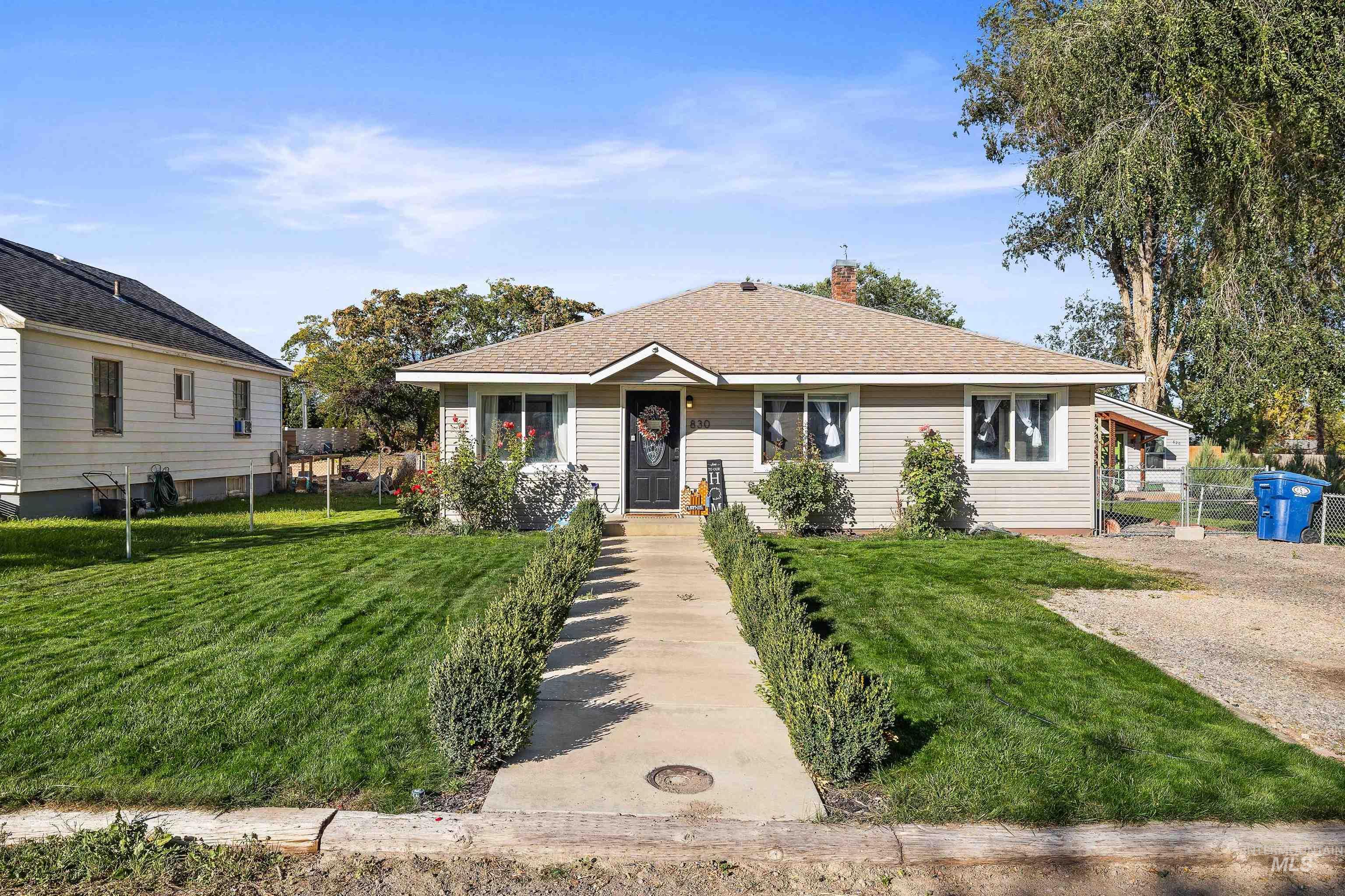 Bungalow-style house with a chimney and a shingled roof