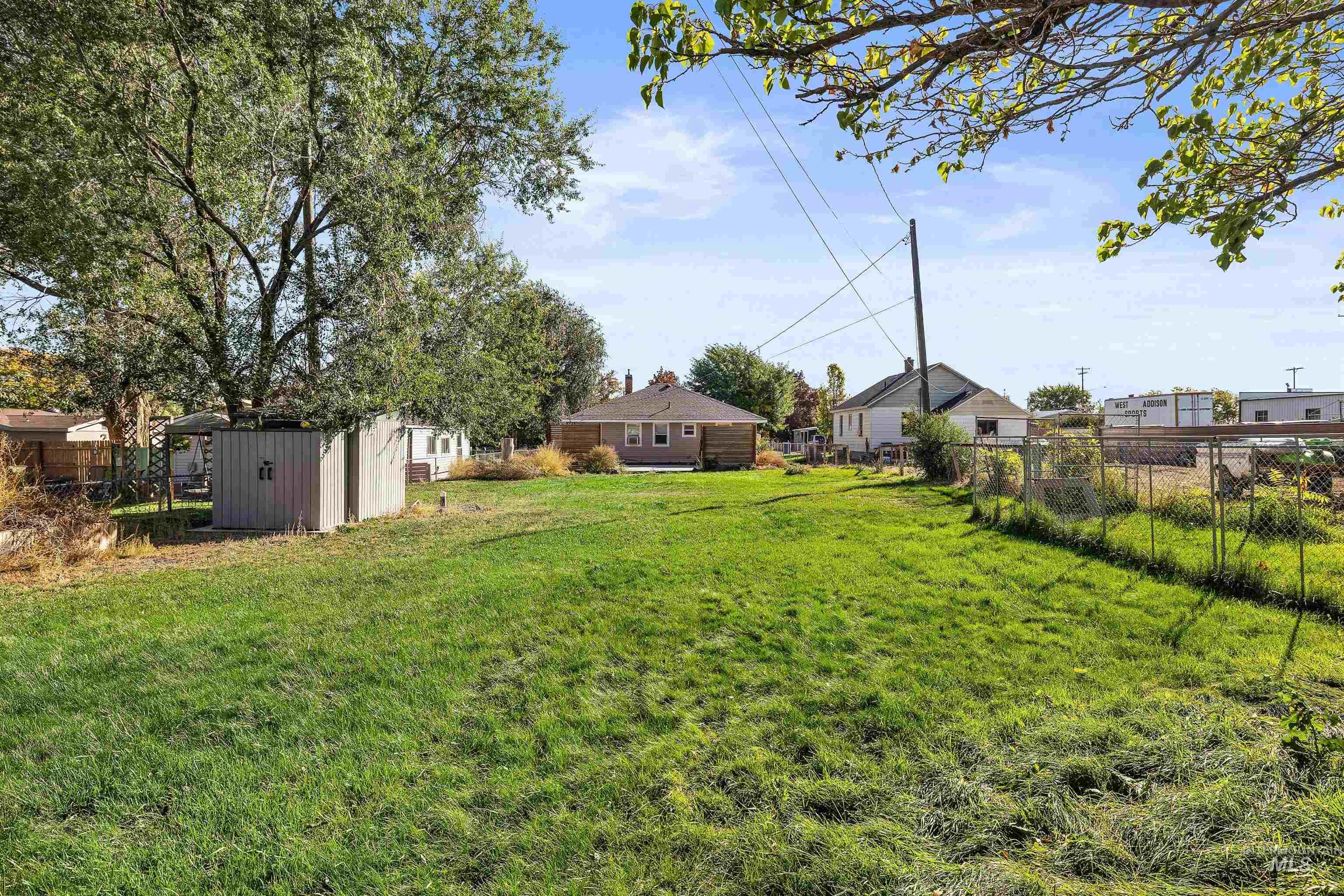 View of yard featuring a storage unit
