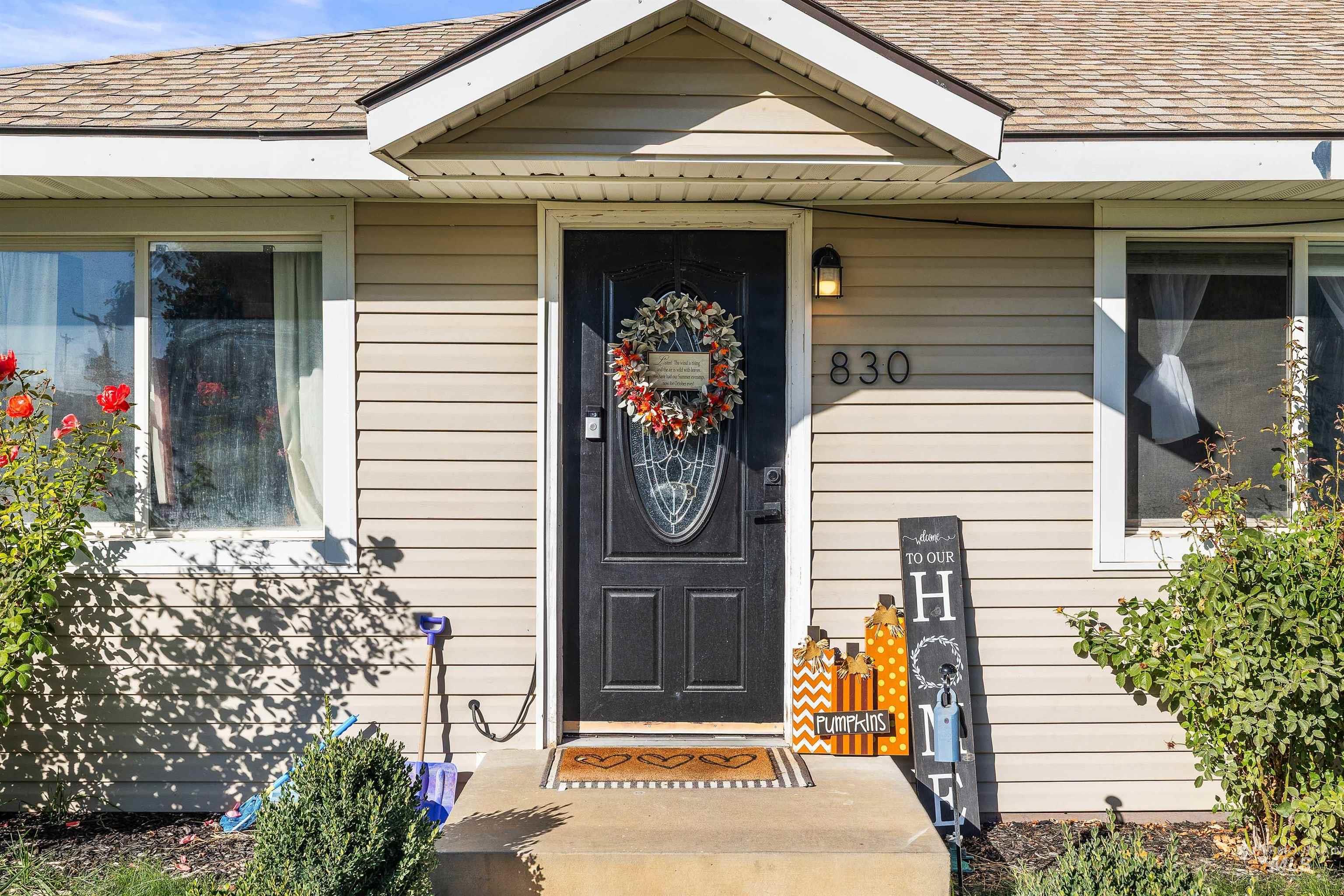 Property entrance with a shingled roof