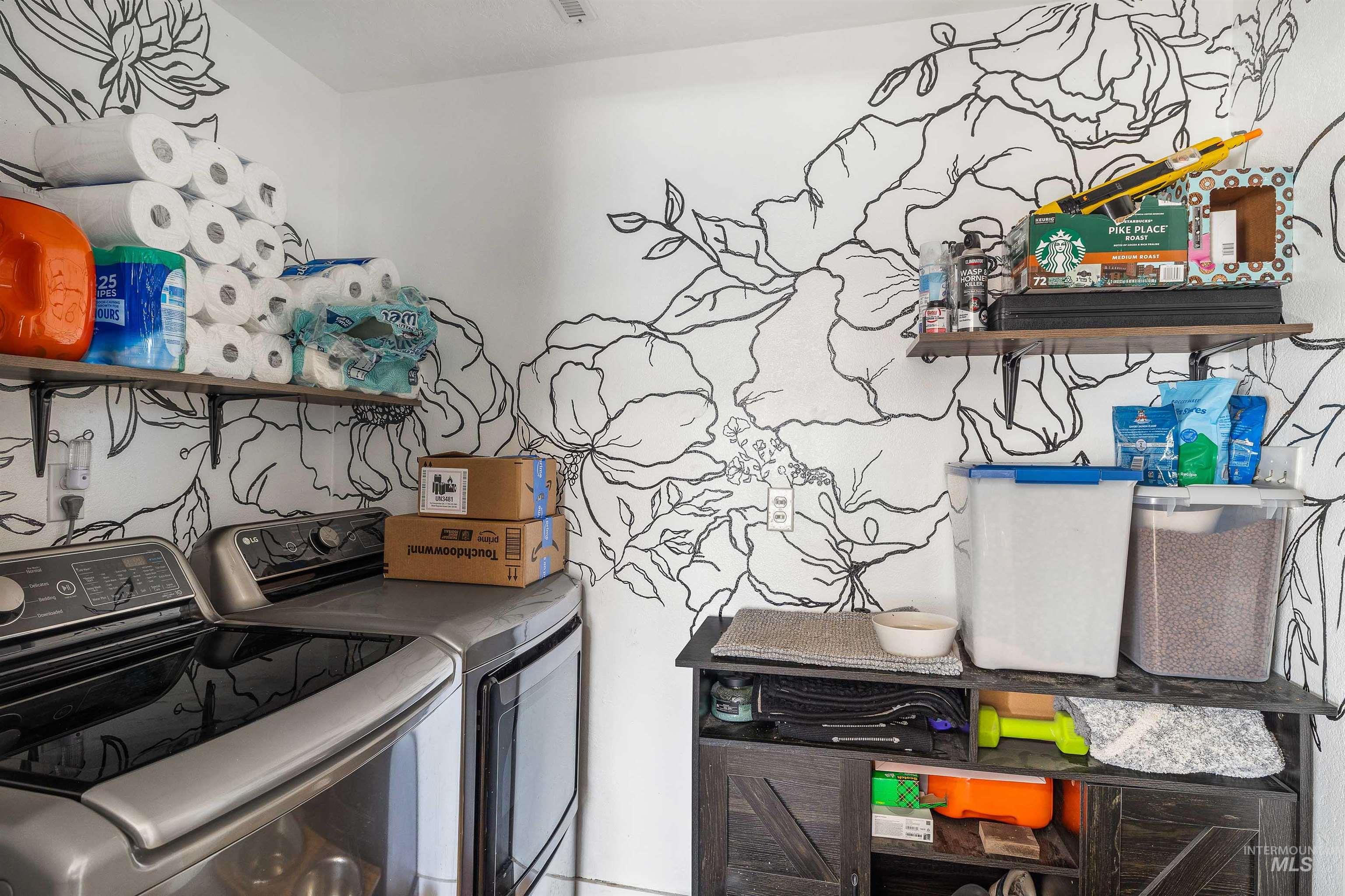 Washroom featuring washing machine and dryer