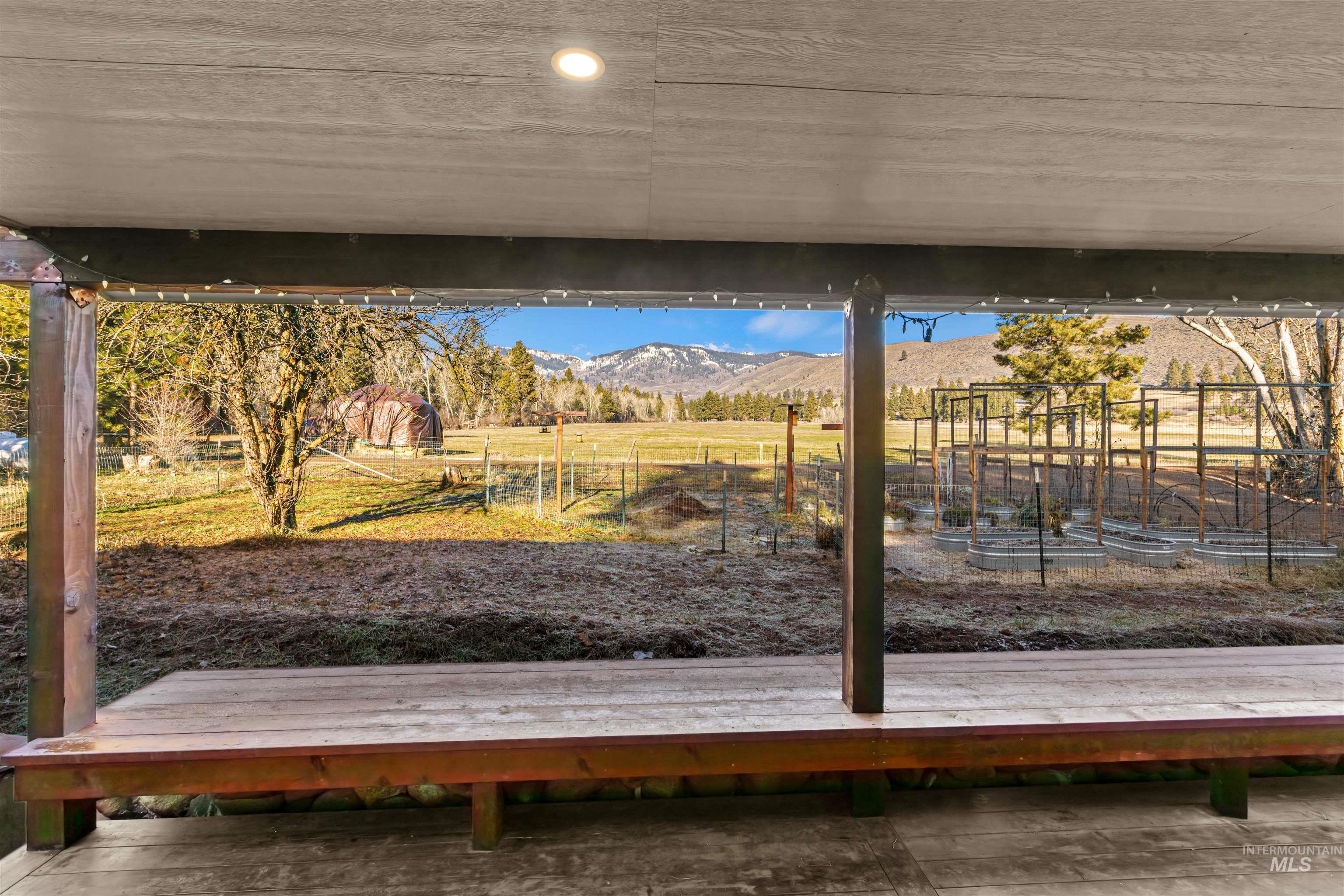 Dock area with a mountain view and a view of rural / pastoral area