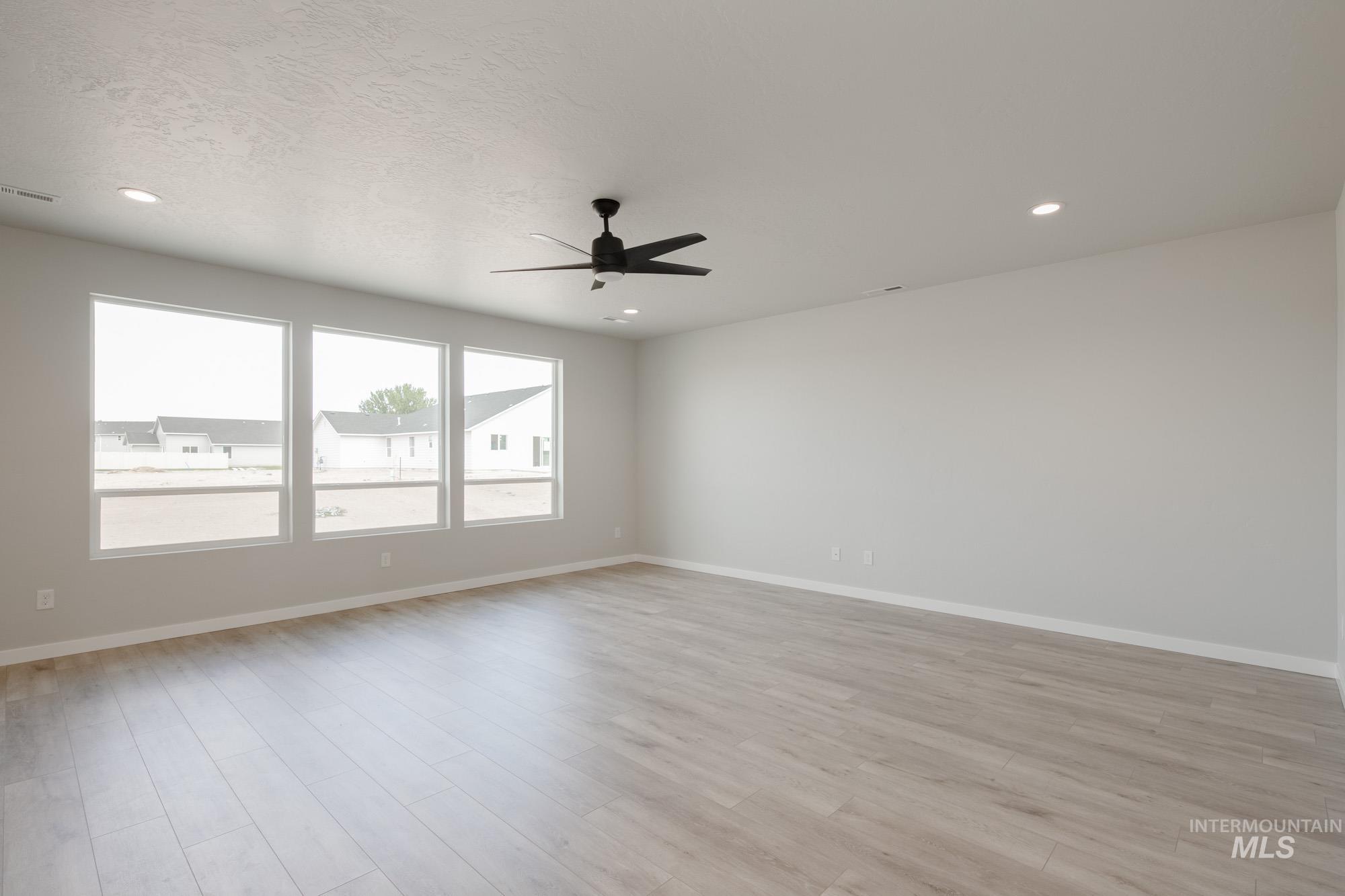 Unfurnished room with light wood finished floors, recessed lighting, and ceiling fan
