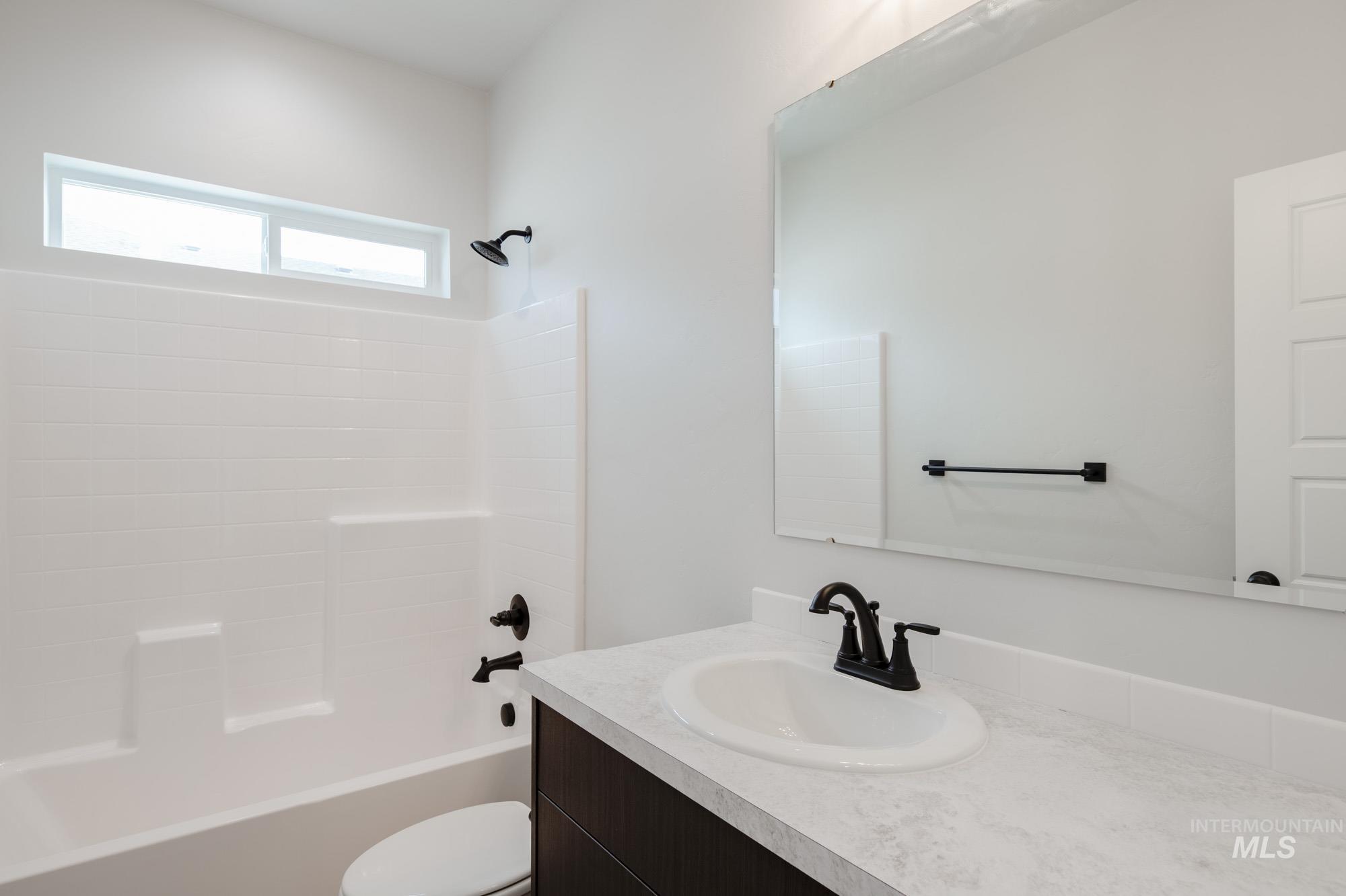 Full bath with bathtub / shower combination and vanity