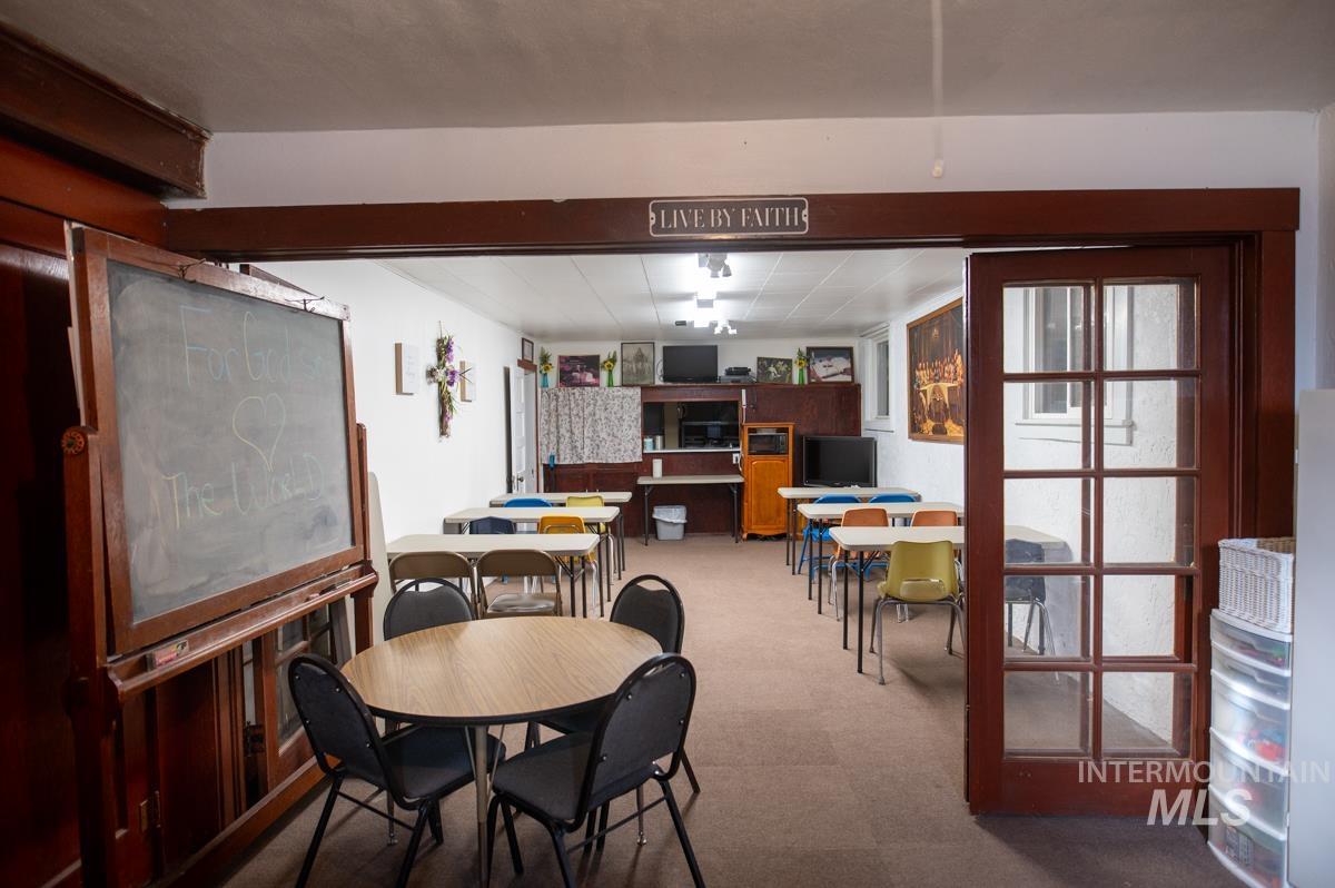 Dining area with light carpet