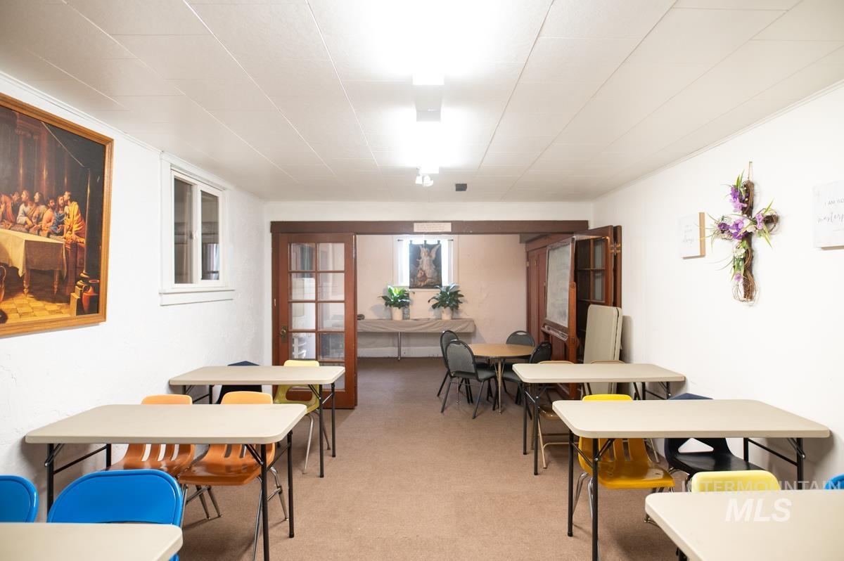 Dining area featuring light colored carpet and french doors