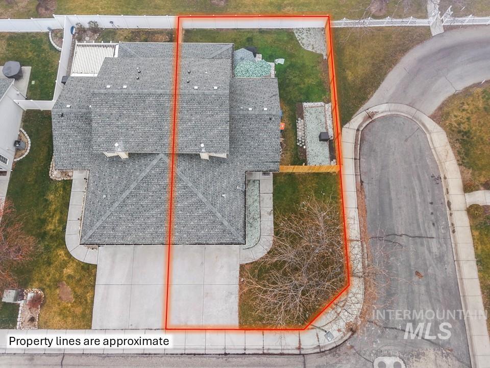 Aerial view of property and surrounding area with property parcel outlined