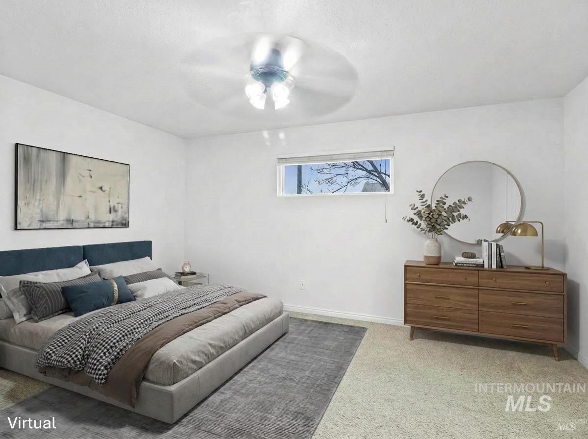 Bedroom featuring carpet and a ceiling fan