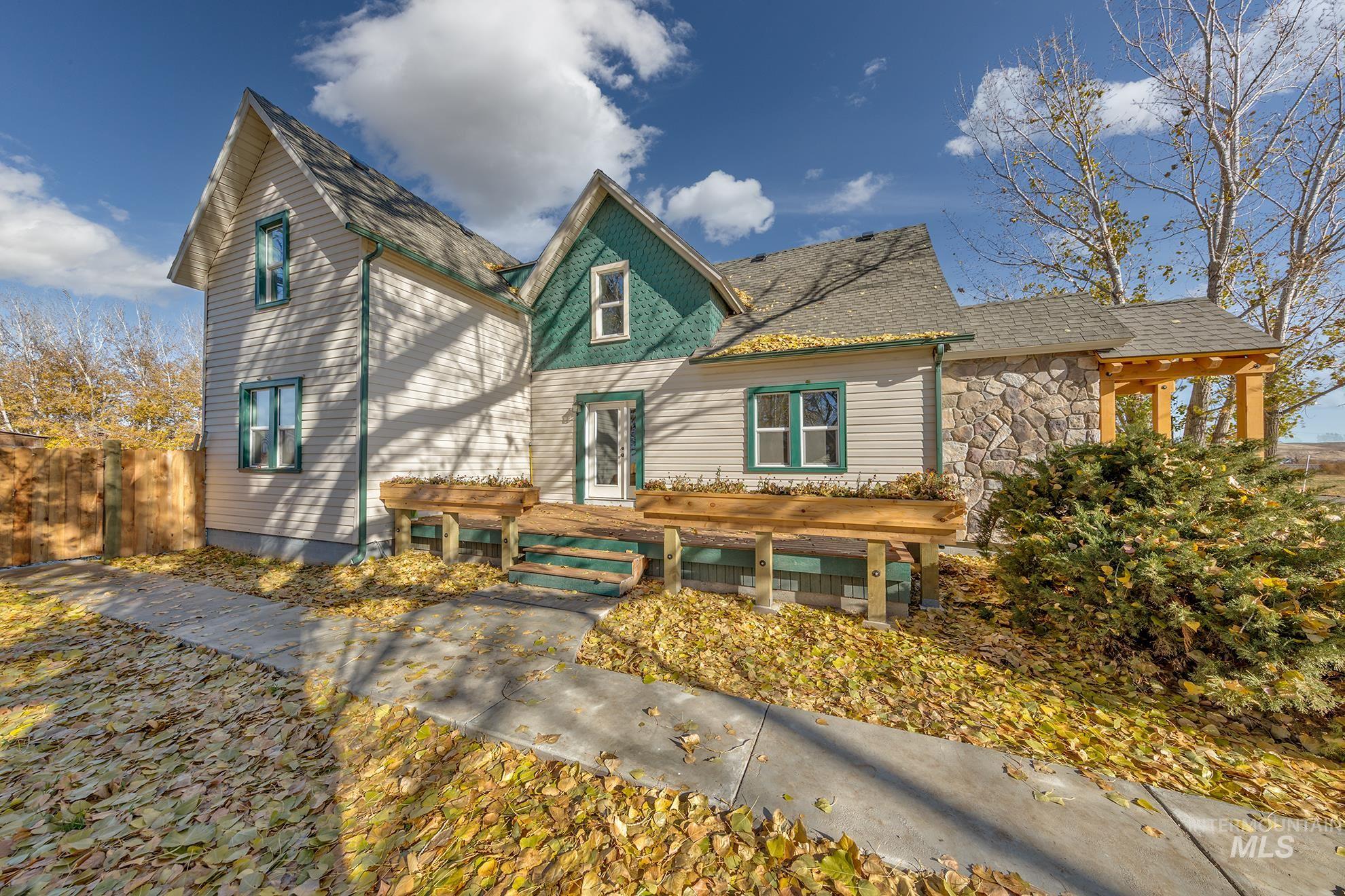 Victorian-style house with stone siding