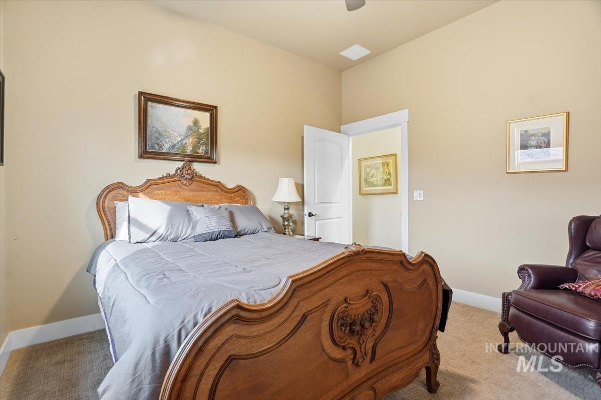 Bedroom featuring carpet floors and a ceiling fan