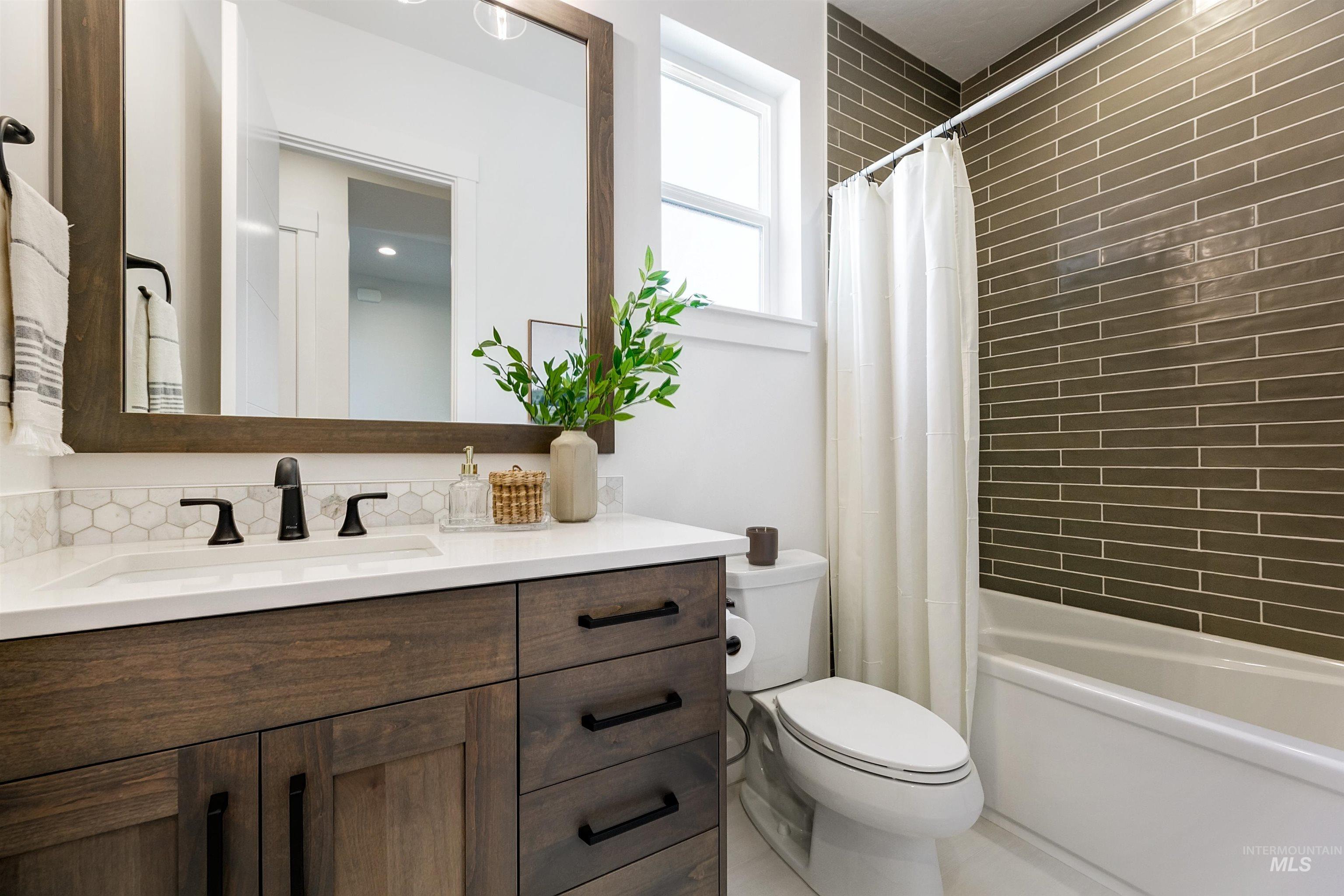 Full bathroom with vanity and shower / bath combo