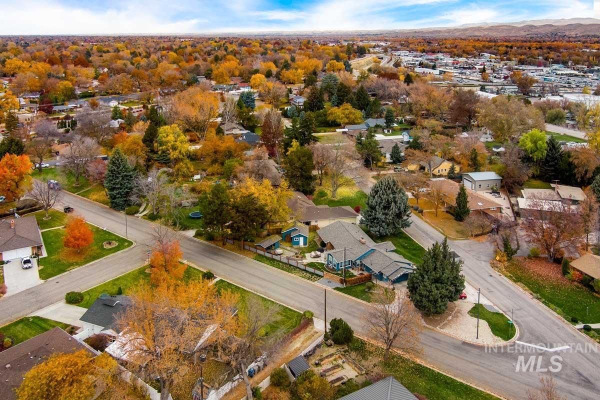 Aerial view of property's location featuring nearby suburban area