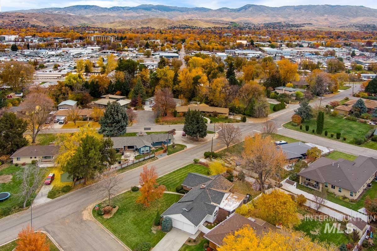 View of property location with a mountain backdrop and nearby suburban area