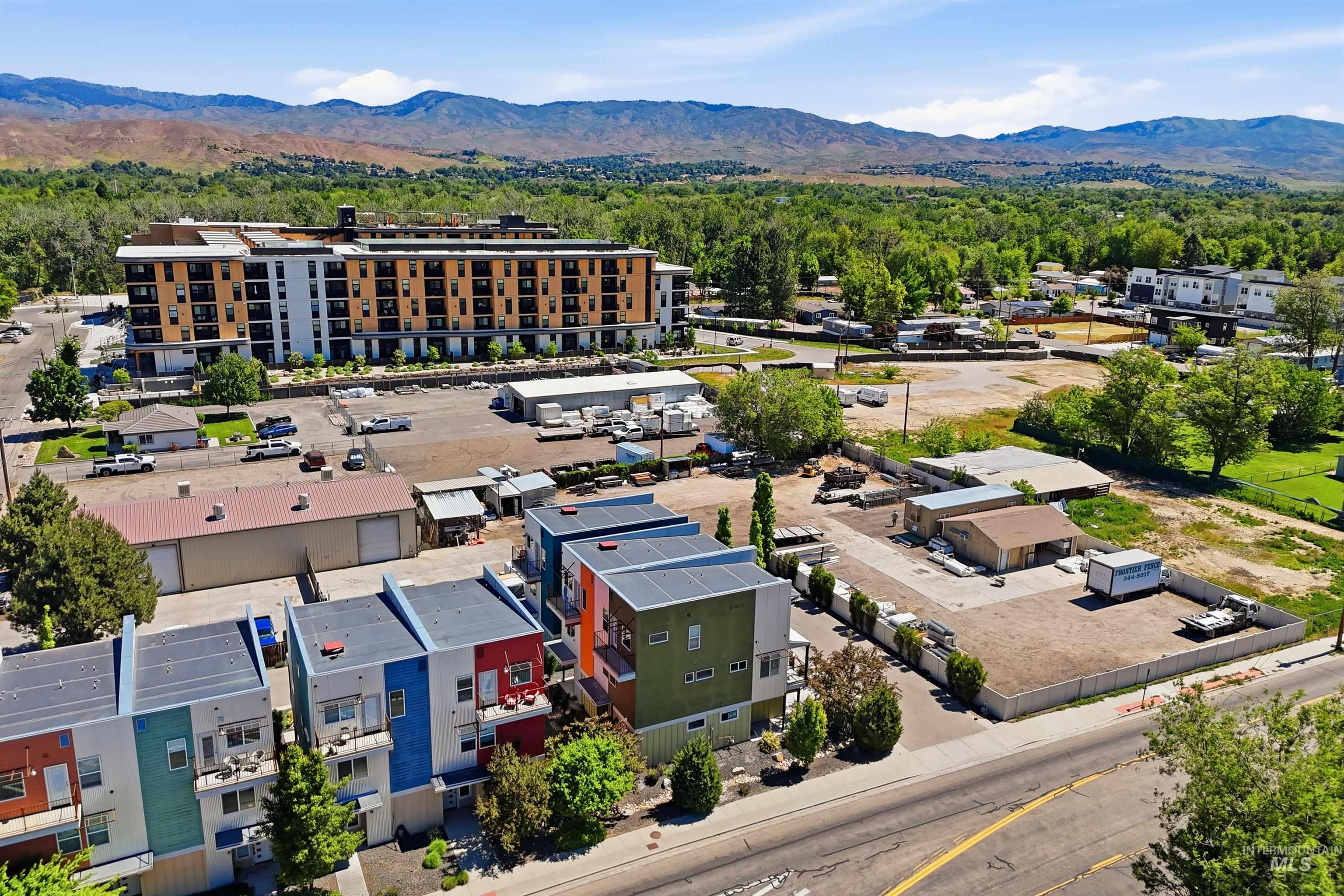 Modern townhome development featuring multi-level units with colorful facades