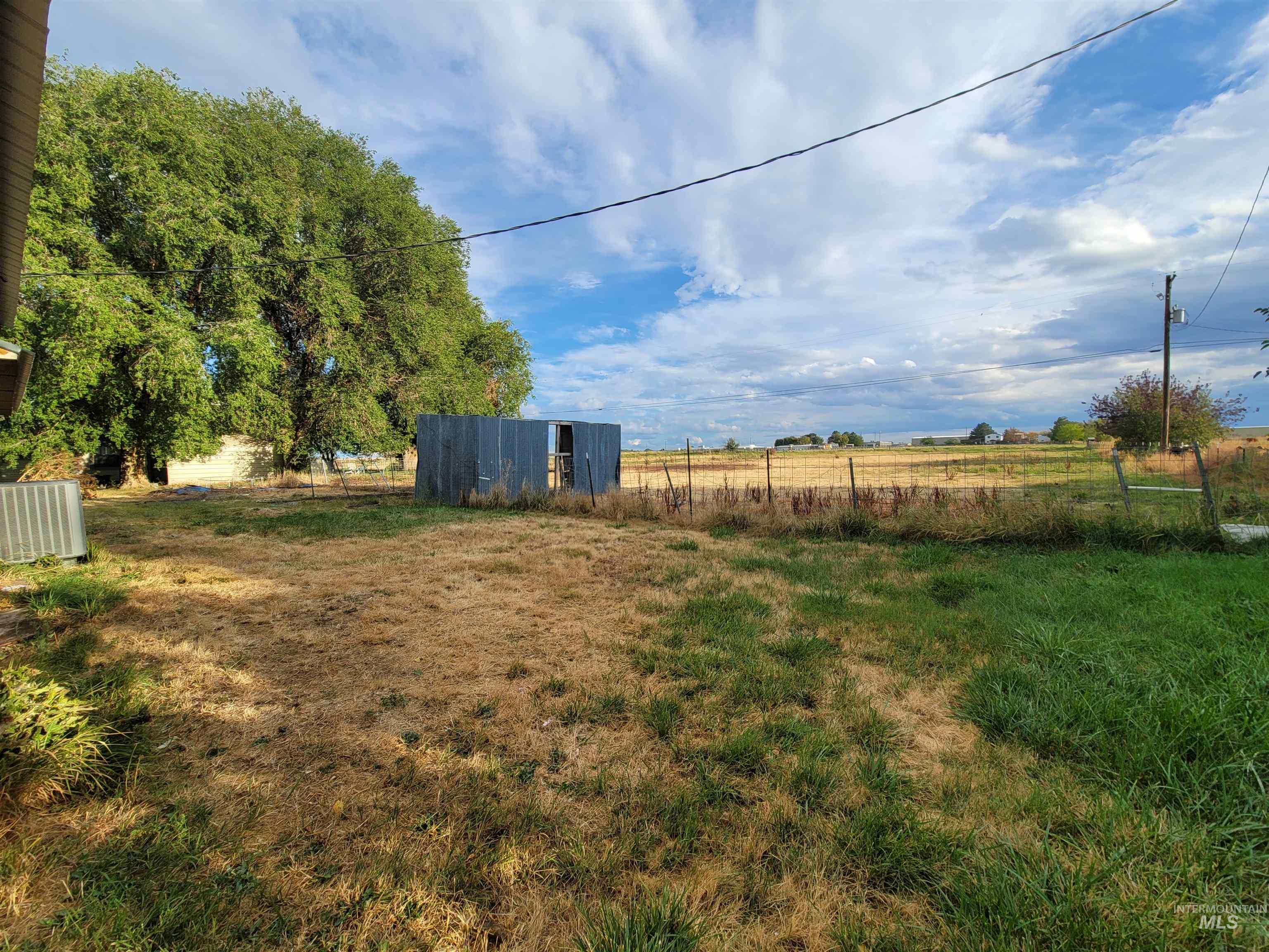 View of yard featuring a view of countryside and an outdoor structure