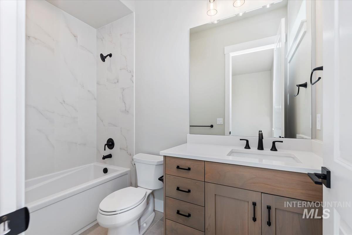 Full bathroom with vanity and shower / tub combination