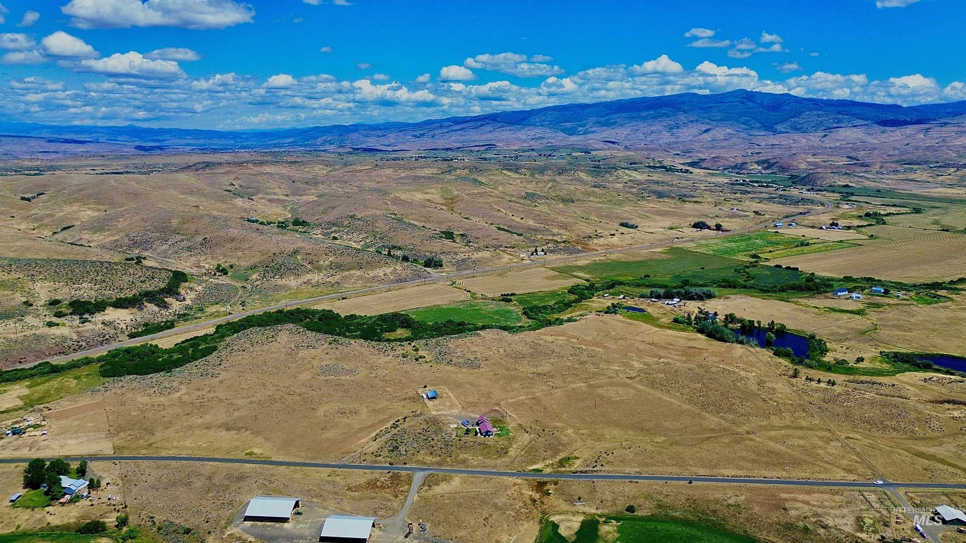 Overview of rural landscape featuring a mountain backdrop