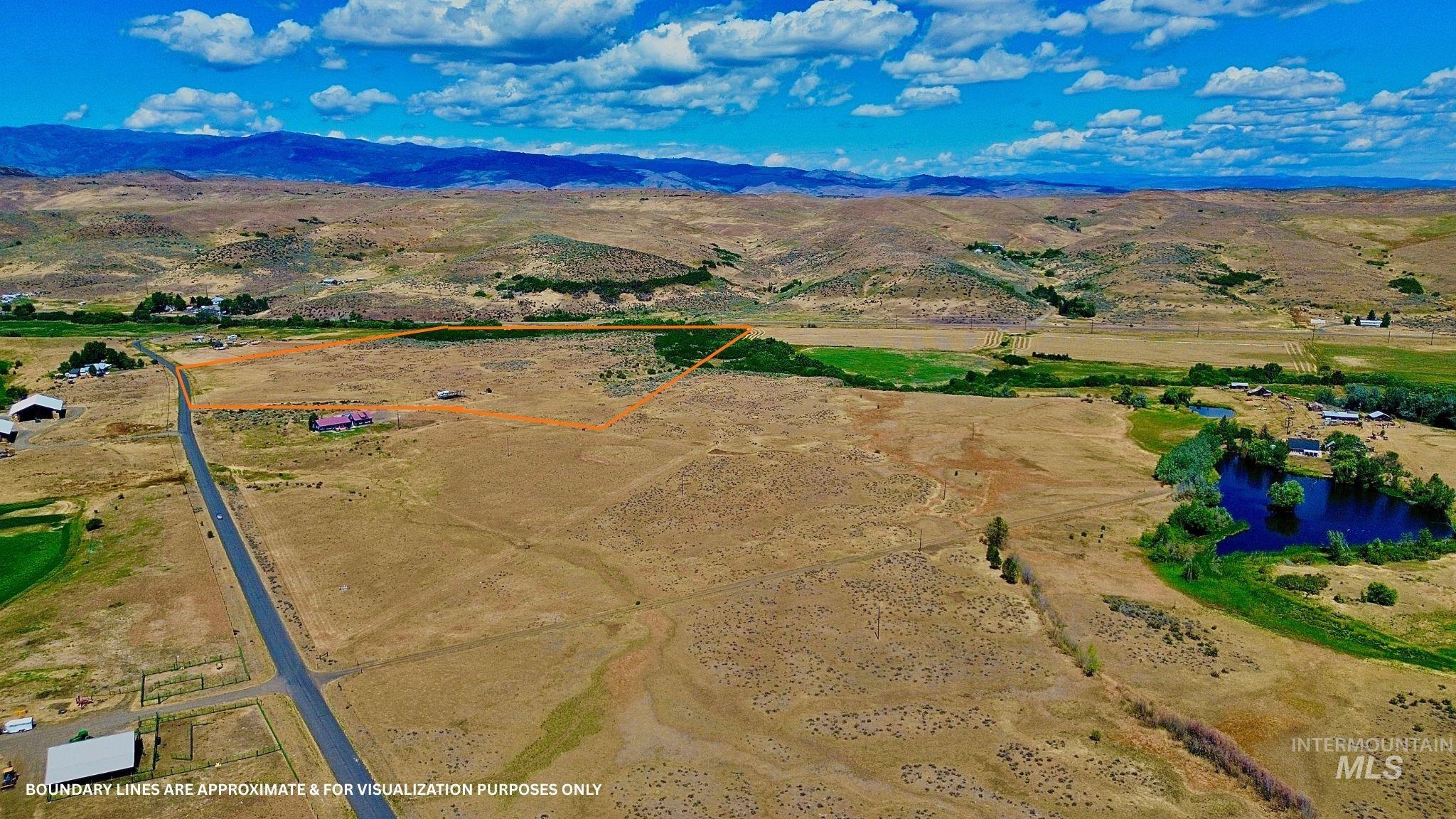 View of rural area with a water and mountain view