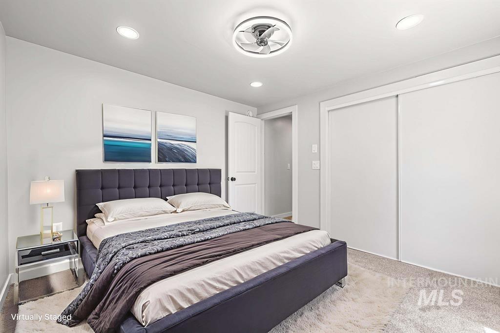 Bedroom featuring a closet, carpet, and recessed lighting