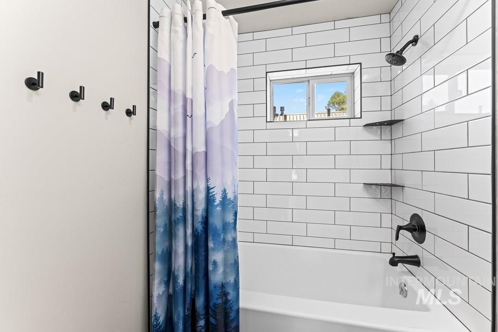 Bathroom featuring shower / bath combo