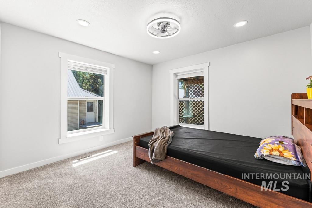 Bedroom with carpet floors and recessed lighting