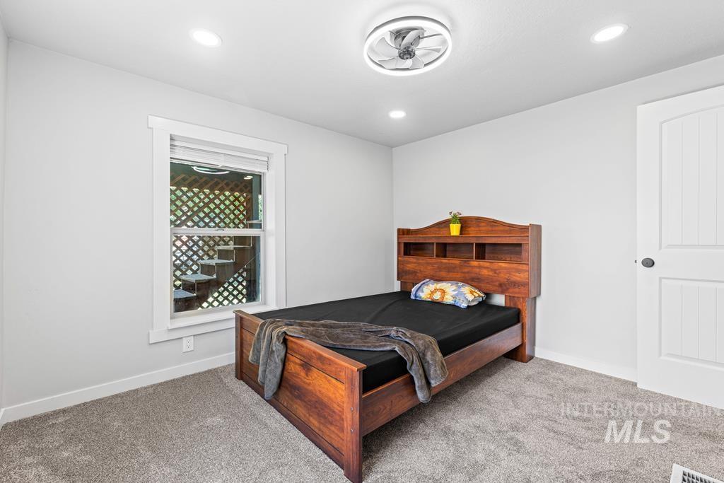 Bedroom with carpet floors and recessed lighting