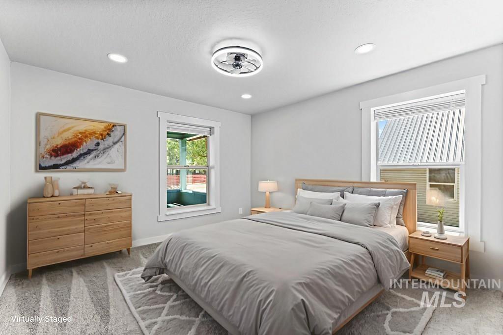 Bedroom with carpet floors and recessed lighting
