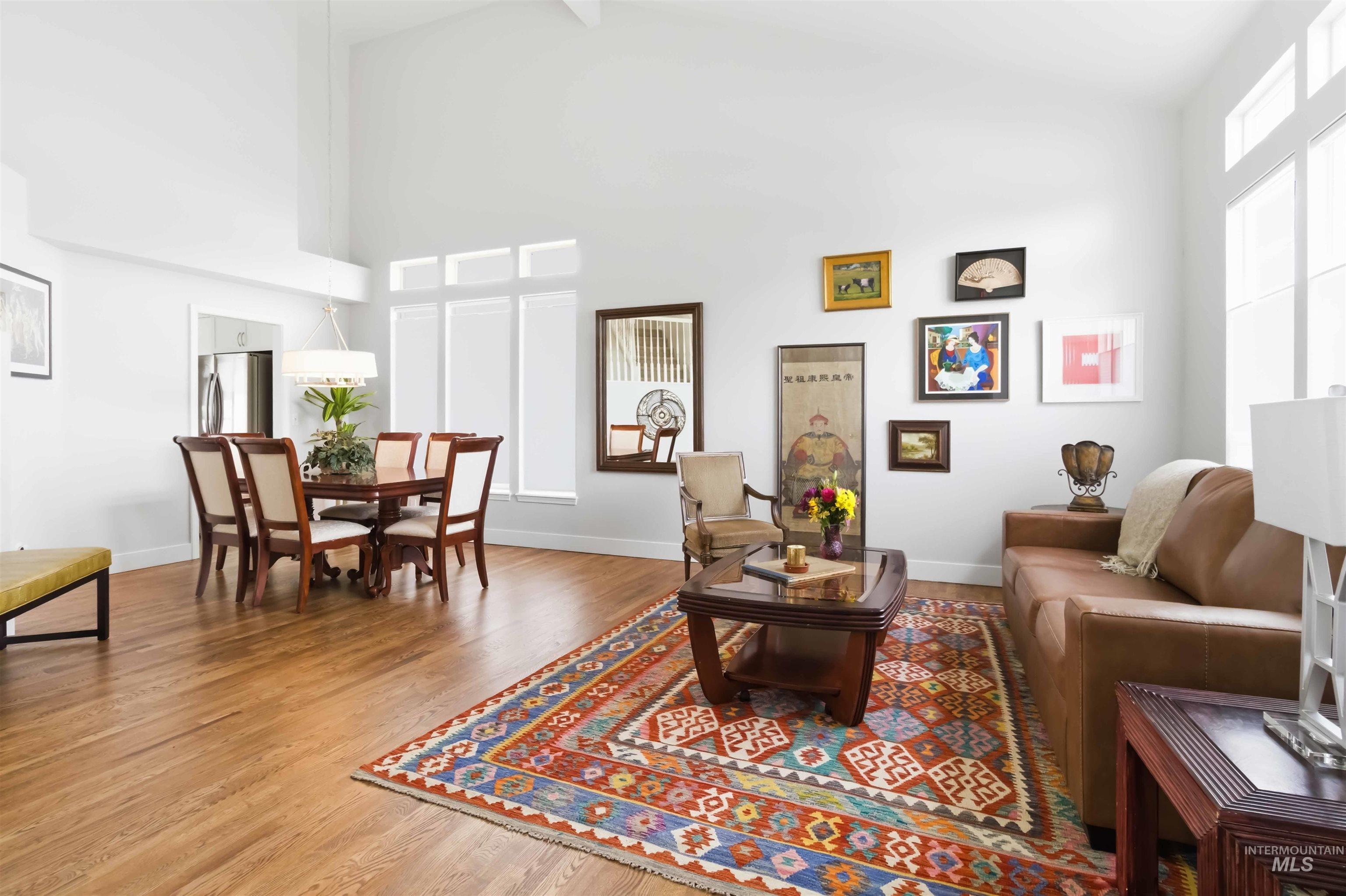 Living area featuring wood finished floors and vaulted ceiling