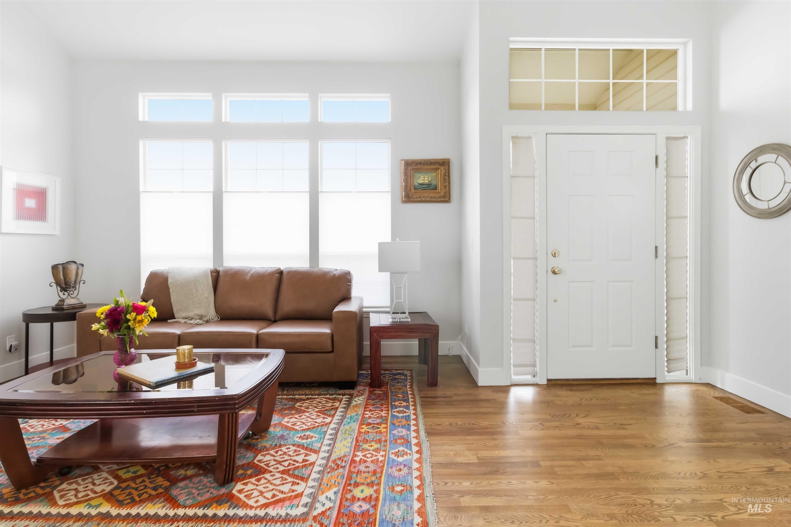 Foyer with wood finished floors and baseboards