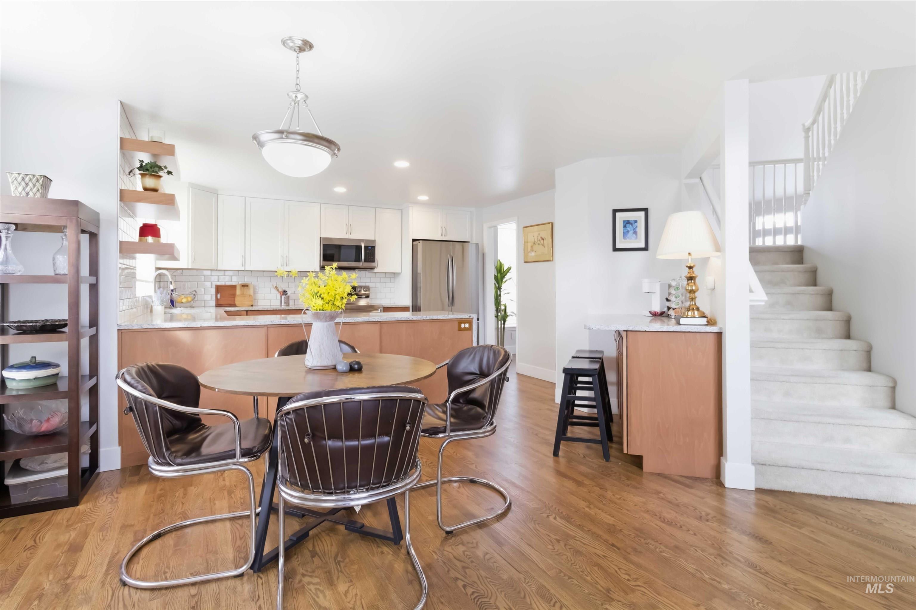 Dining room featuring light wood finished floors and recessed lighting