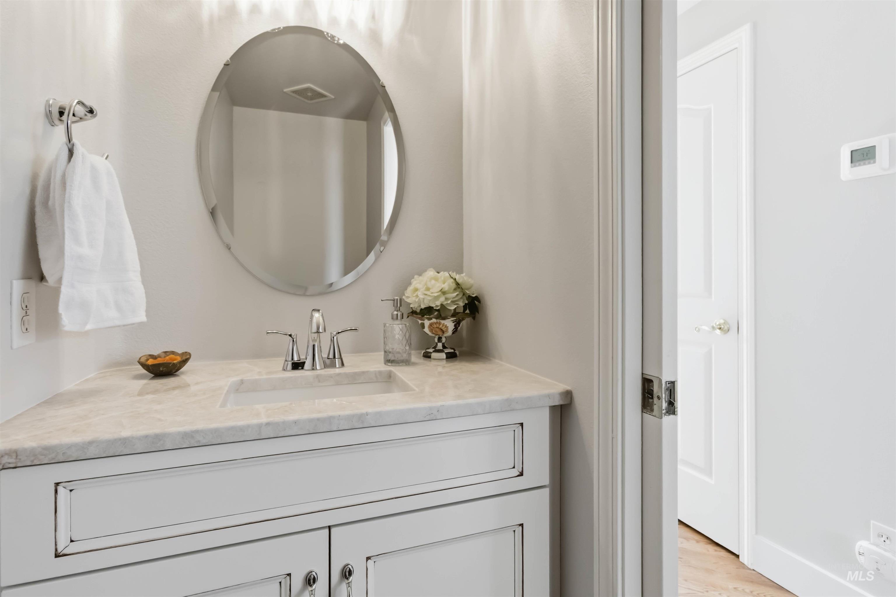 Bathroom featuring vanity and light wood-style flooring