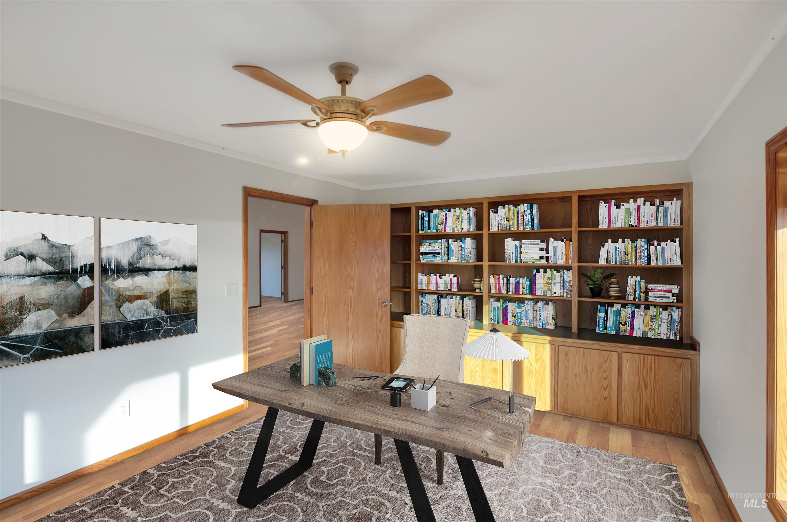 Office with wood finished floors, a ceiling fan, and crown molding. Note that home is vacant and has been virtually staged for the purpose of this photo.