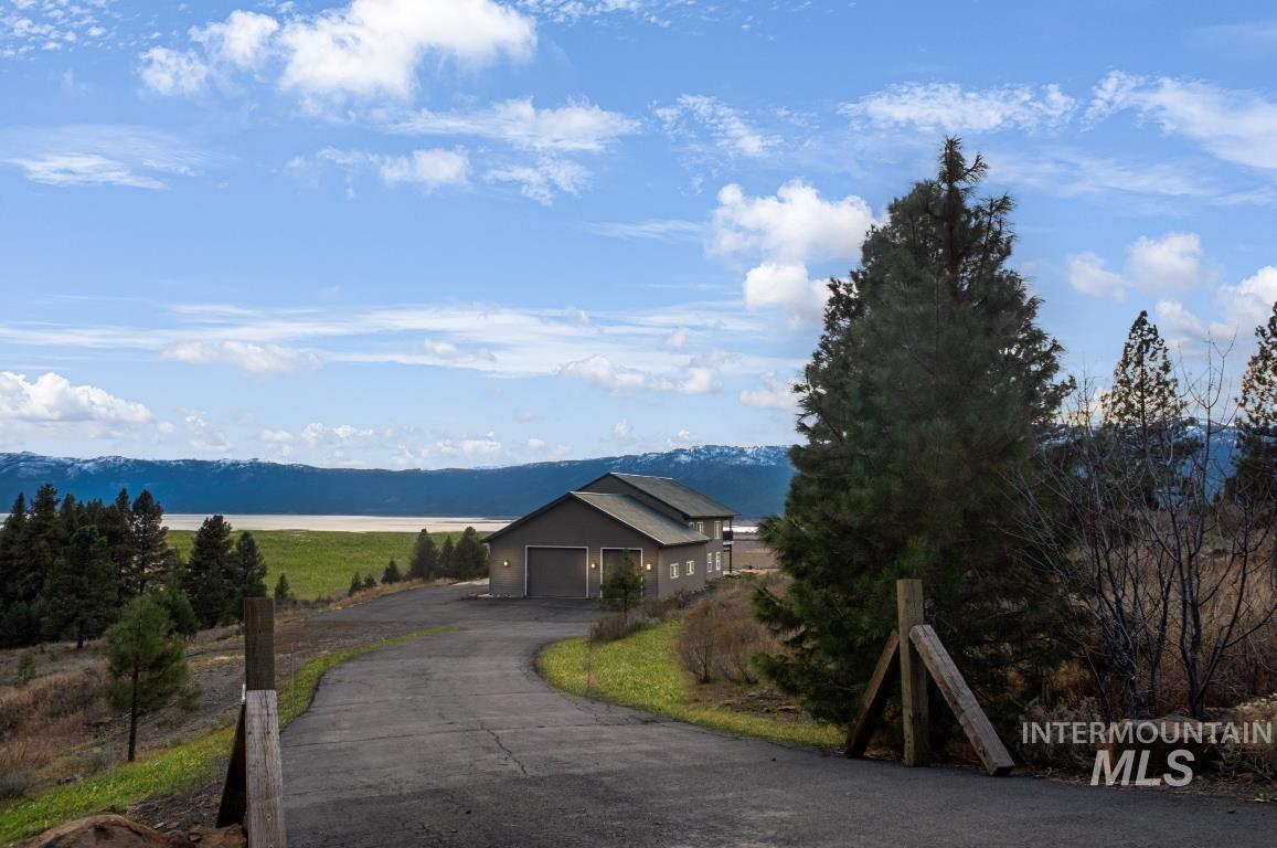View of asphalt driveway with a mountain view