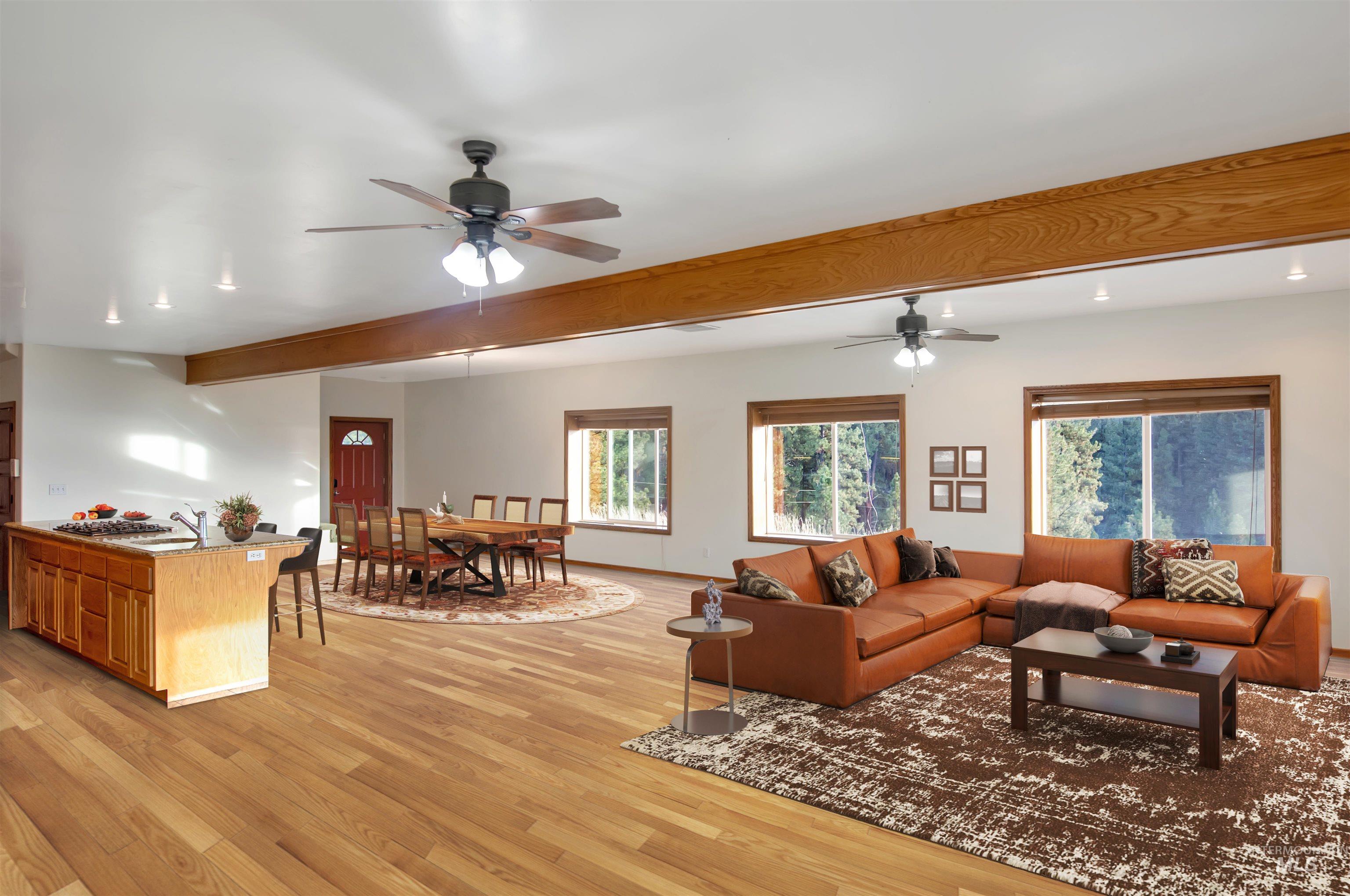 Living room featuring light wood-style flooring, a ceiling fan, beamed ceiling, and recessed lighting. Note that home is vacant and has been virtually staged for the purpose of this photo.
