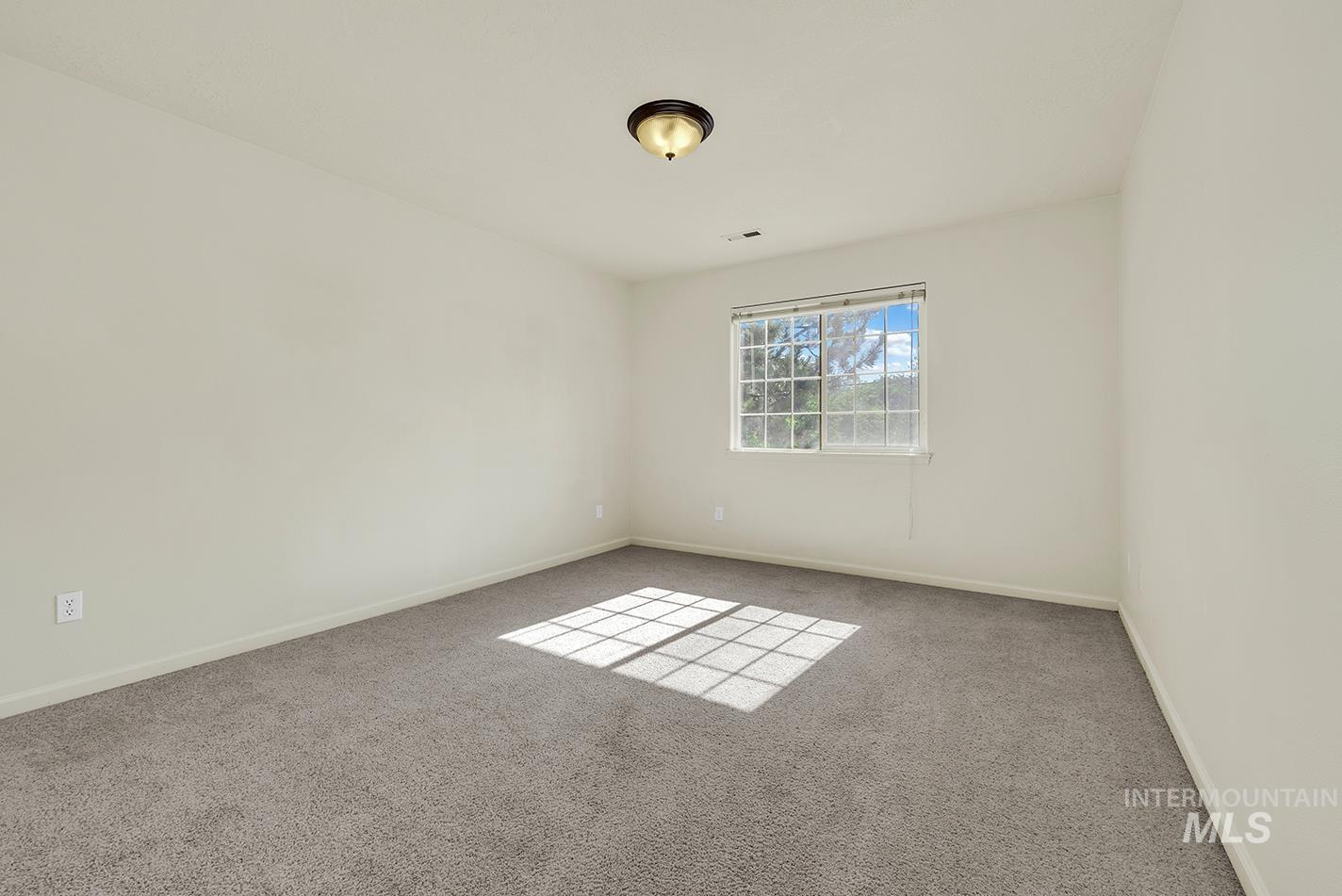 Spare room featuring carpet floors