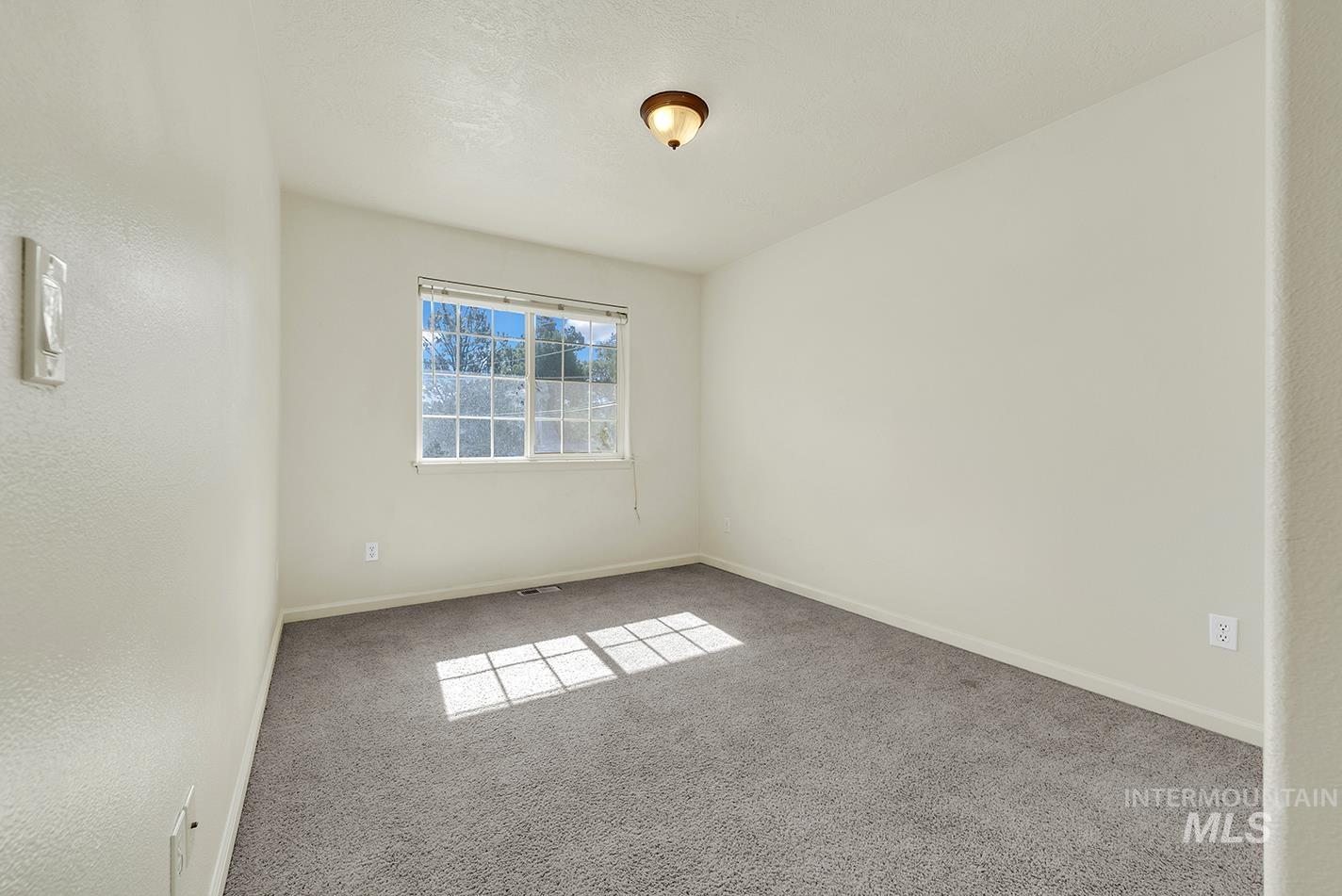 Empty room with carpet flooring