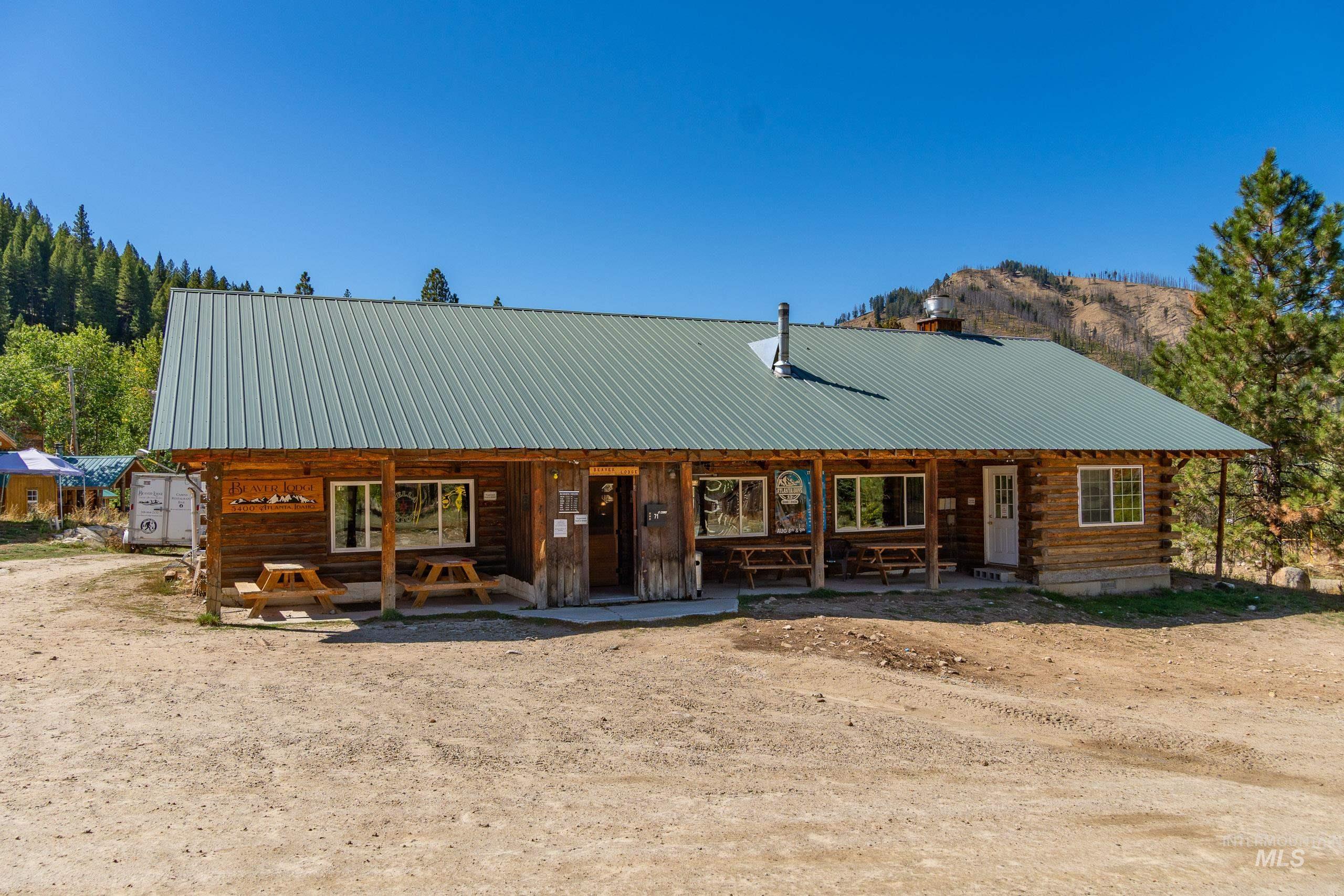 Log home with a metal roof and log siding